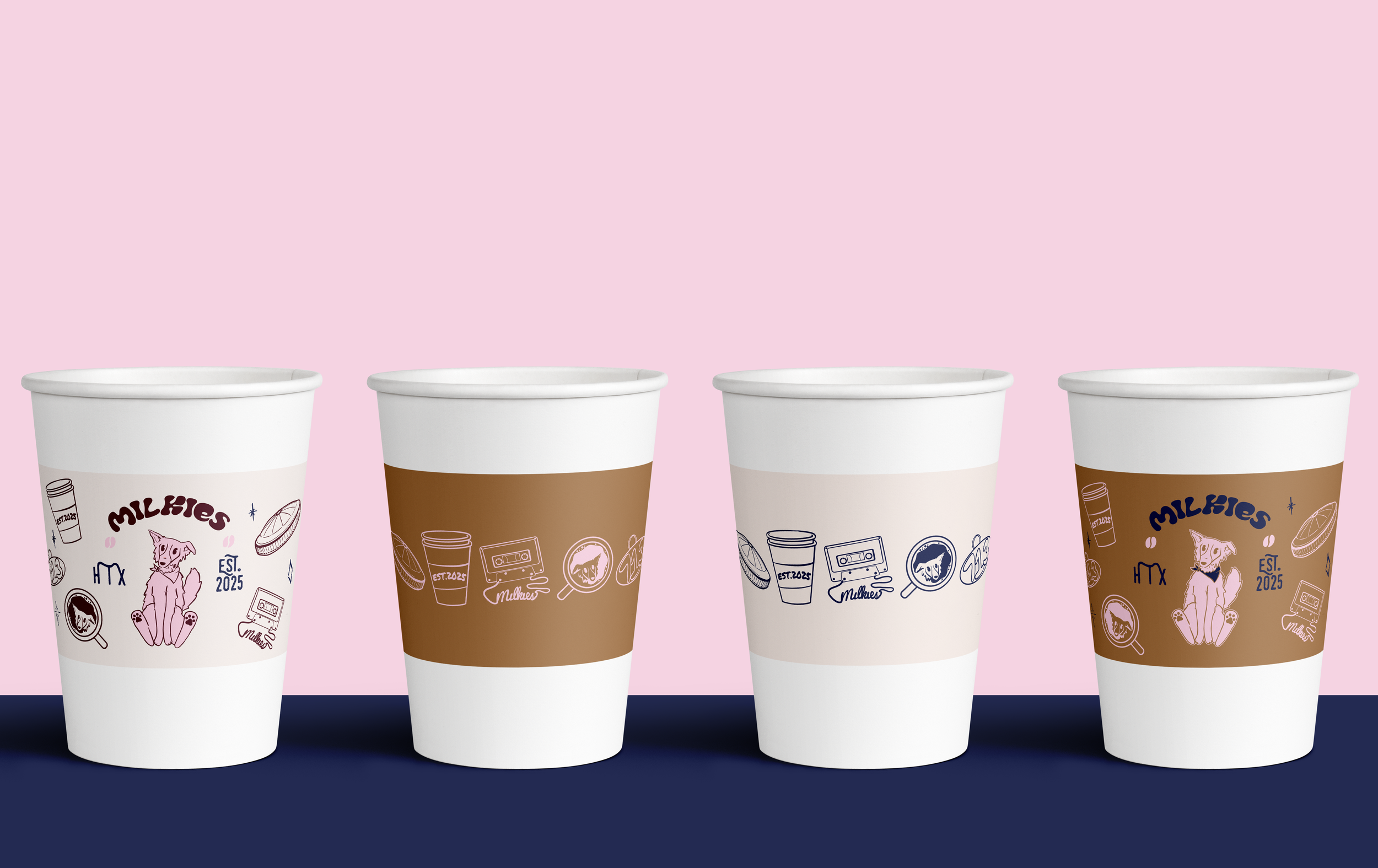 Four disposable coffee cups with colorful doodle designs on a pink background.