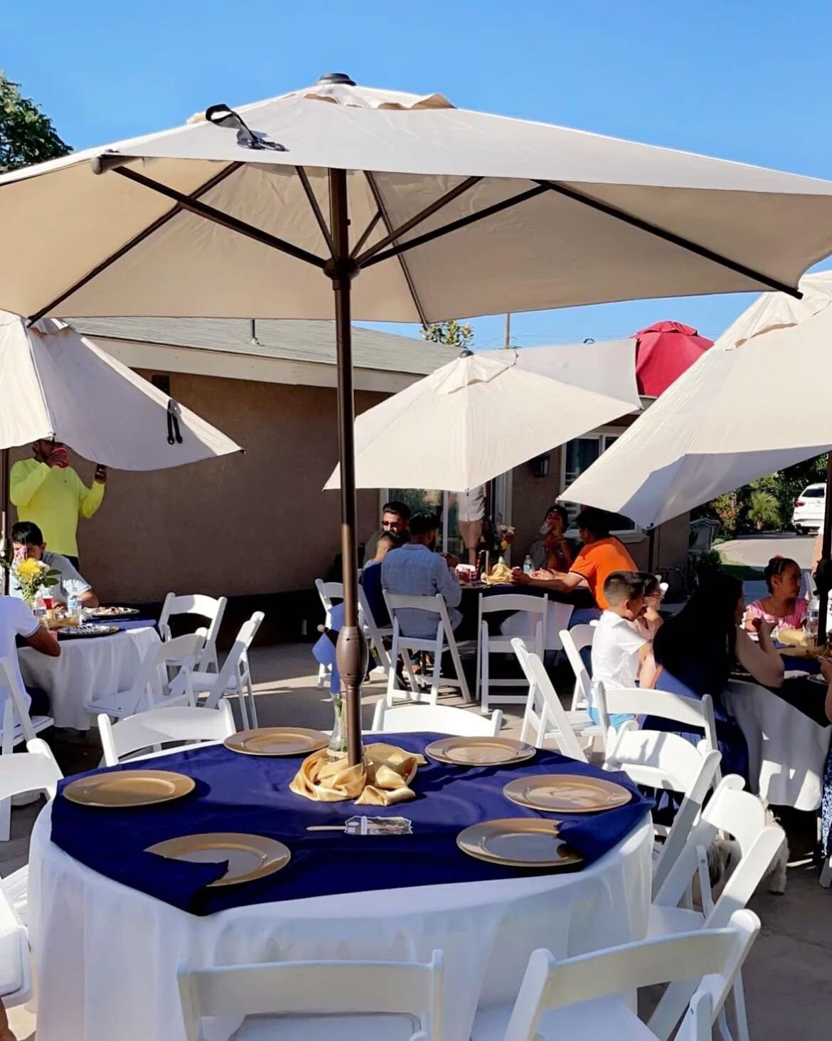 Umbrellas, chairs, tables, tablecloths