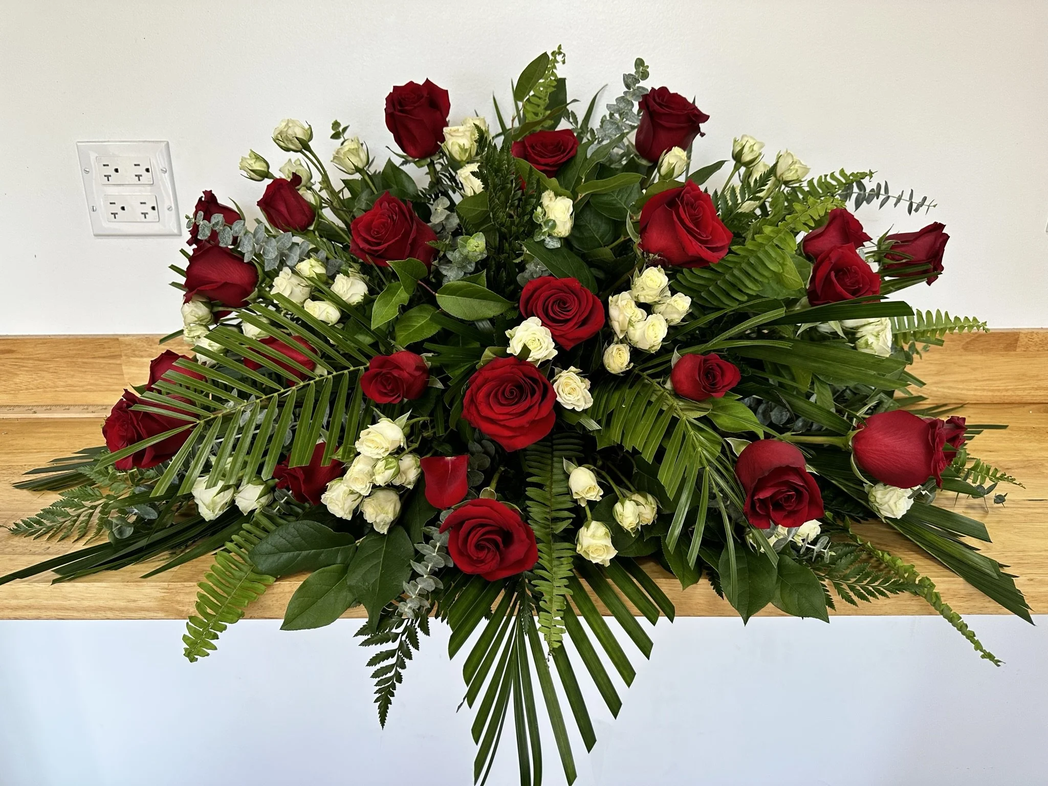 Lava Red Rose Casket Spray