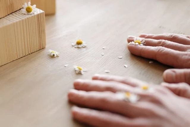 hands with little flowers