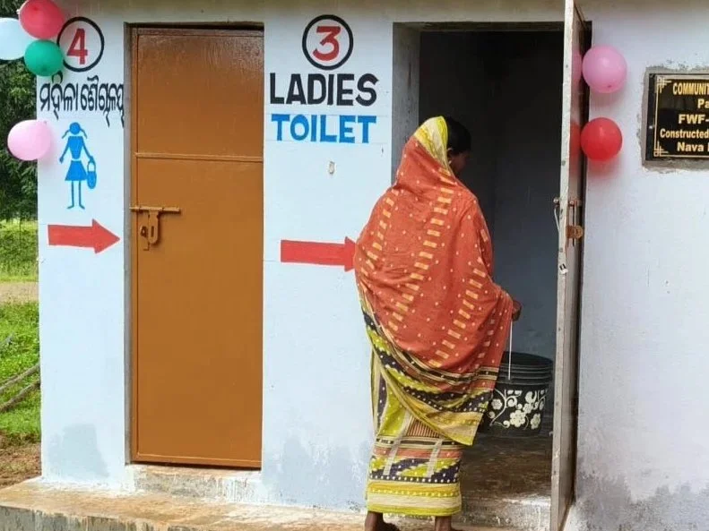 A woman enters a bathhouse