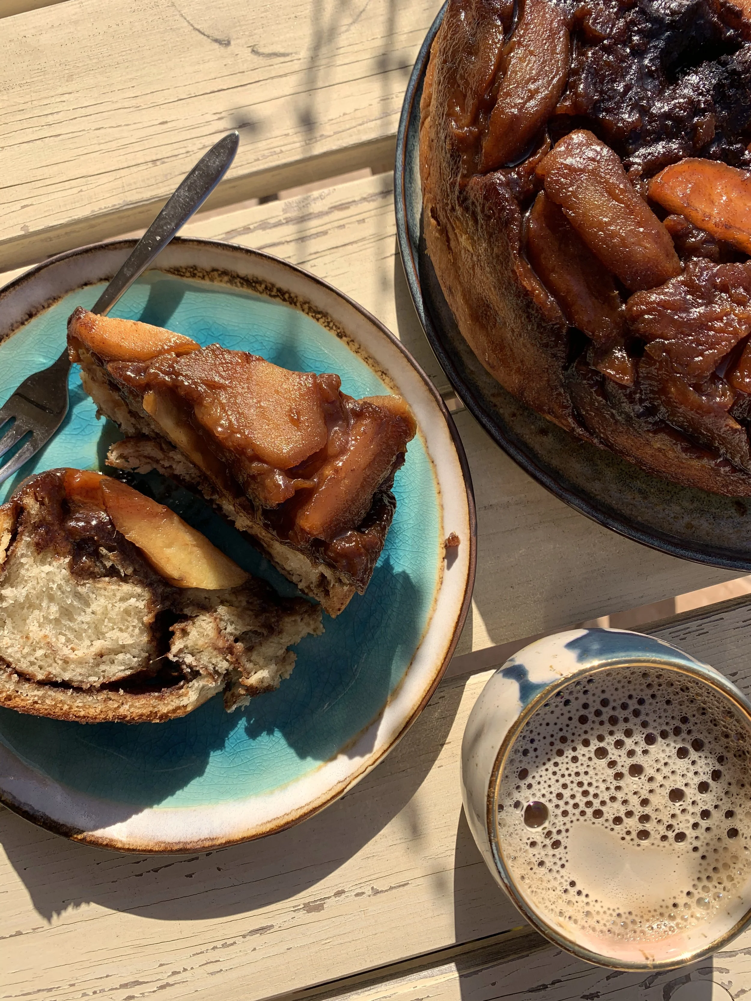 Vegan Cinnamon Roll with Baked Apple on a plate
