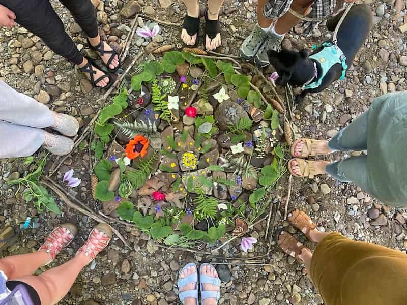 A circle of women outside