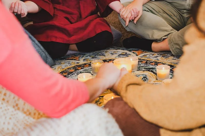 a woman's circle holding hands