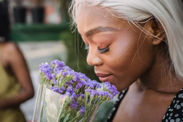 Woman smelling flowers