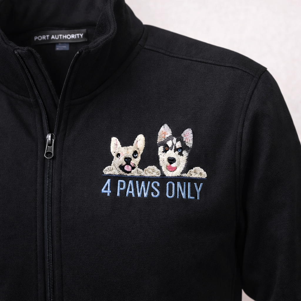 Black jacket with embroidered patch of a puppy and a husky puppy peeking over a ledge, with the text "4 PAWS ONLY" embroidered below them.