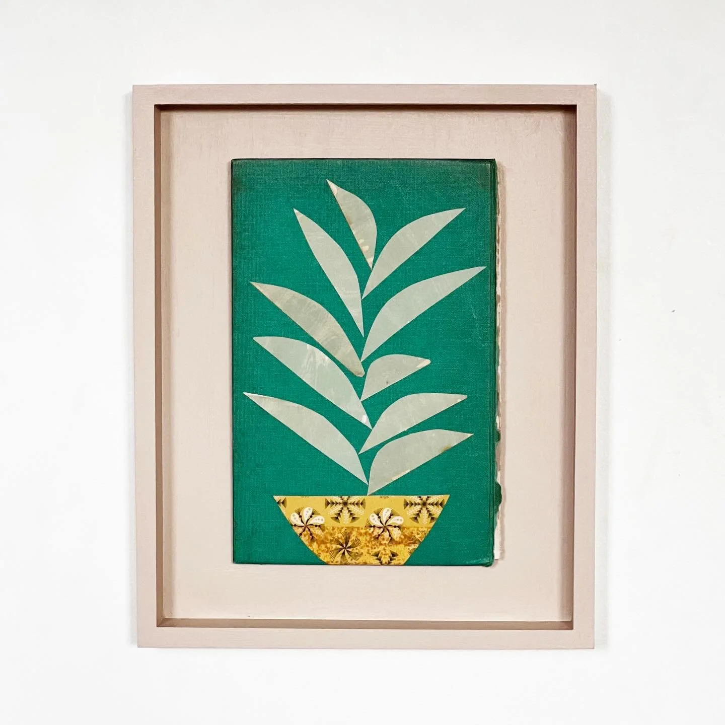 A pretty houseplant in a yellow patterned pot.
No watering needed here.
Still life art, perfect for a peaceful bedroom or living room.

Houseplant III
Paper on book cover
Mounted in an open frame
Size 22x27cm

Available on my website.

#houseplant #b