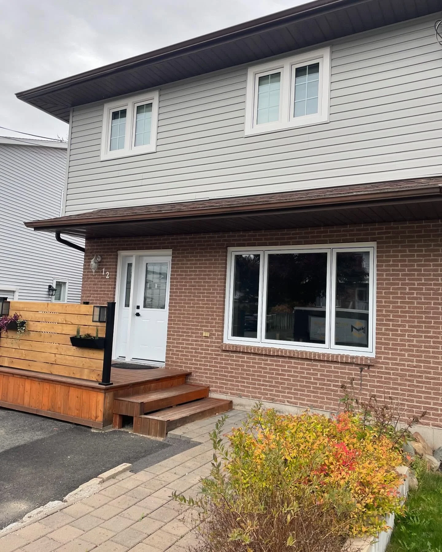 New siding, windows, and door completely changed the look of this house.