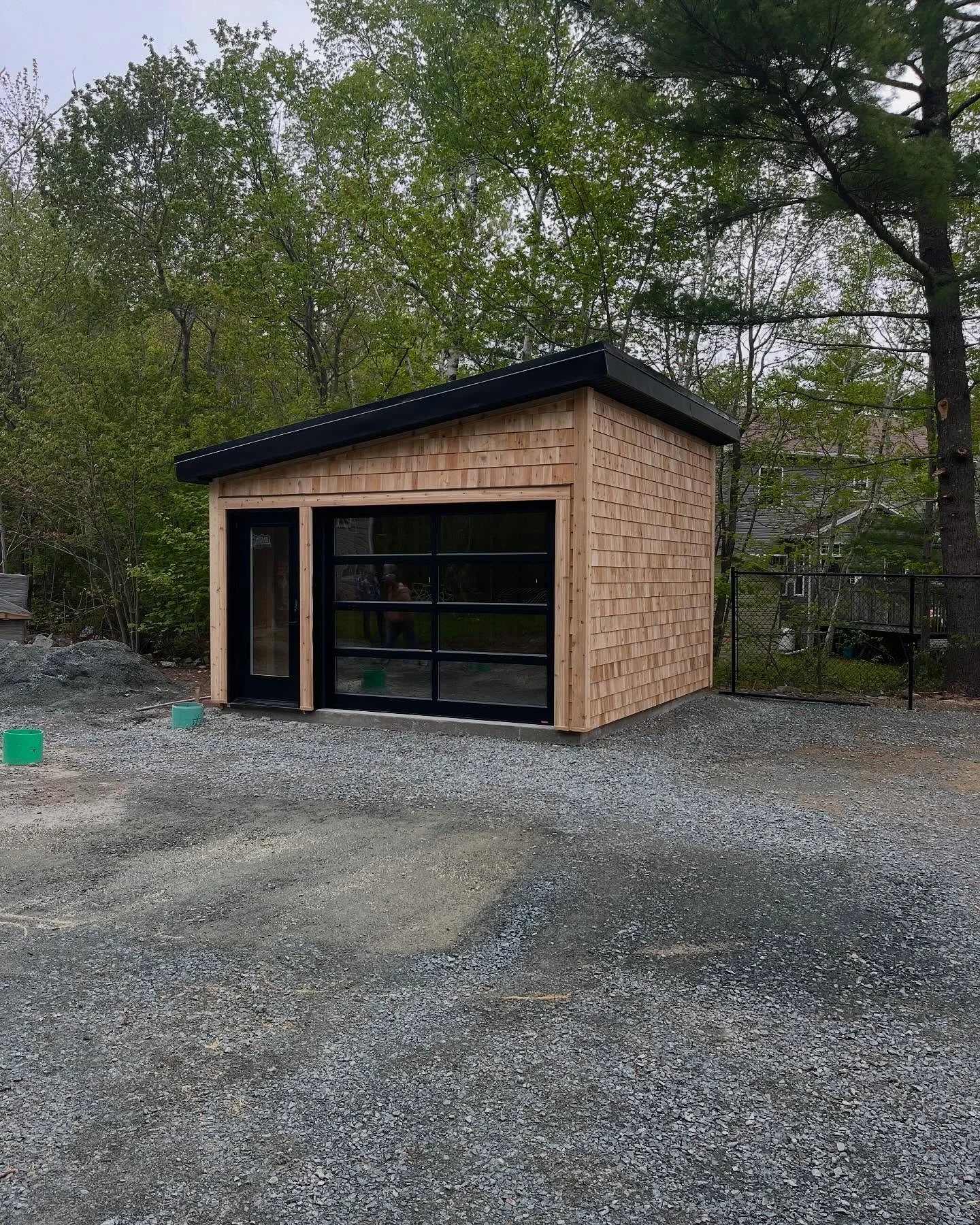 Cedar sided garage with a metal roof we just finished for a repeat customer!