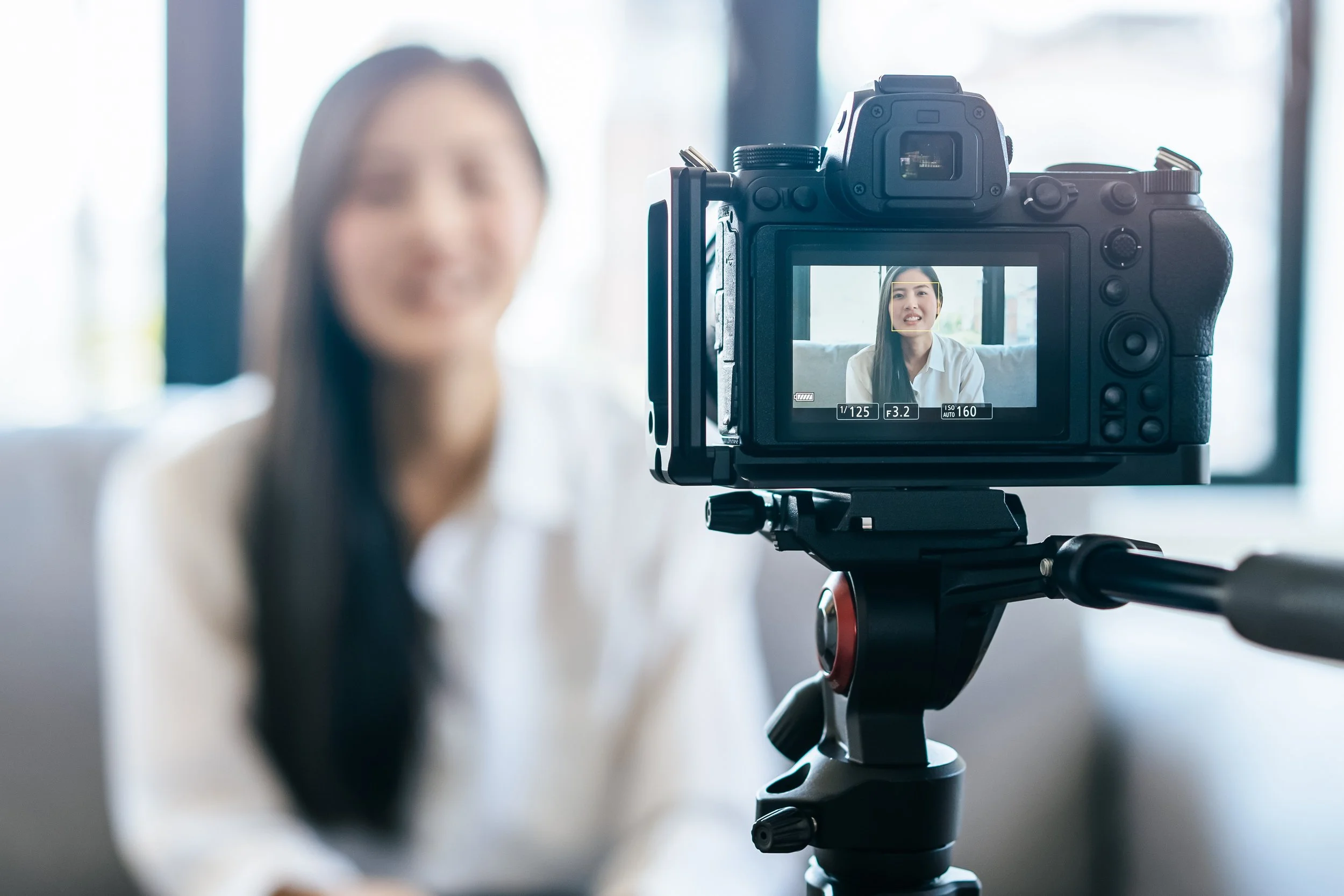 Professional video camera filming a business interview