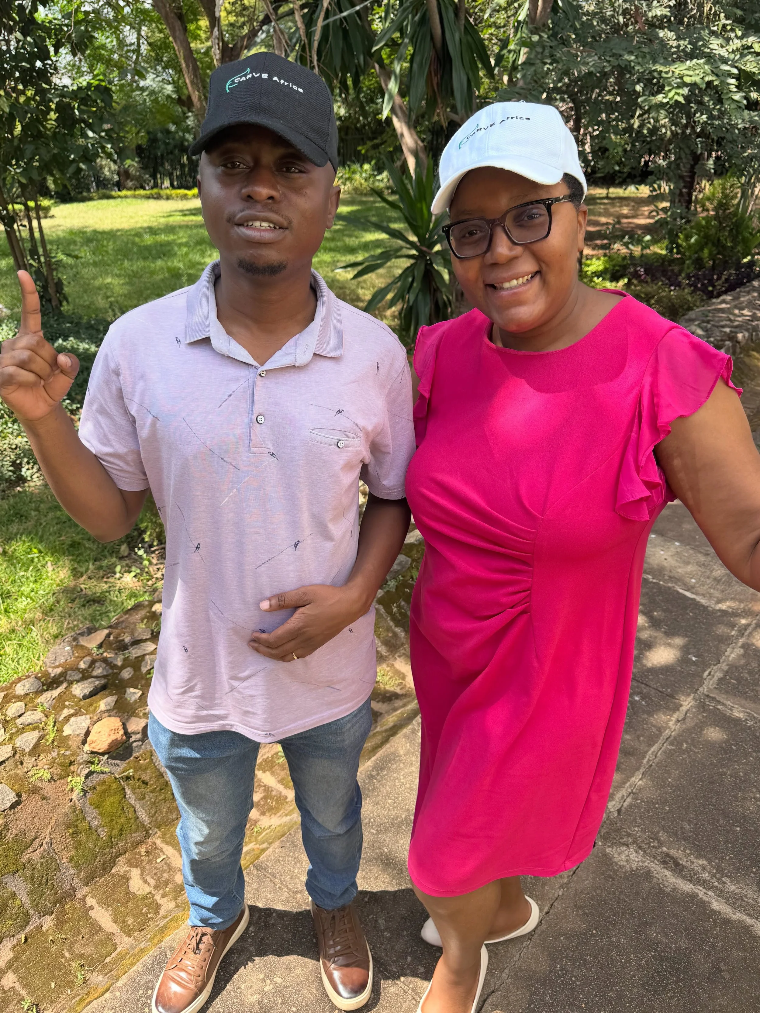 Sporting CARVE Africa hats today 🧢✨ Shammah, our Ops Manager and true organizational glue, and Elizabeth, our Programs Manager &mdash; these two are the heartbeat of what we do. Proud of the team making it all happen in Malawi! 🇲🇼 #CARVEAfrica #Ma