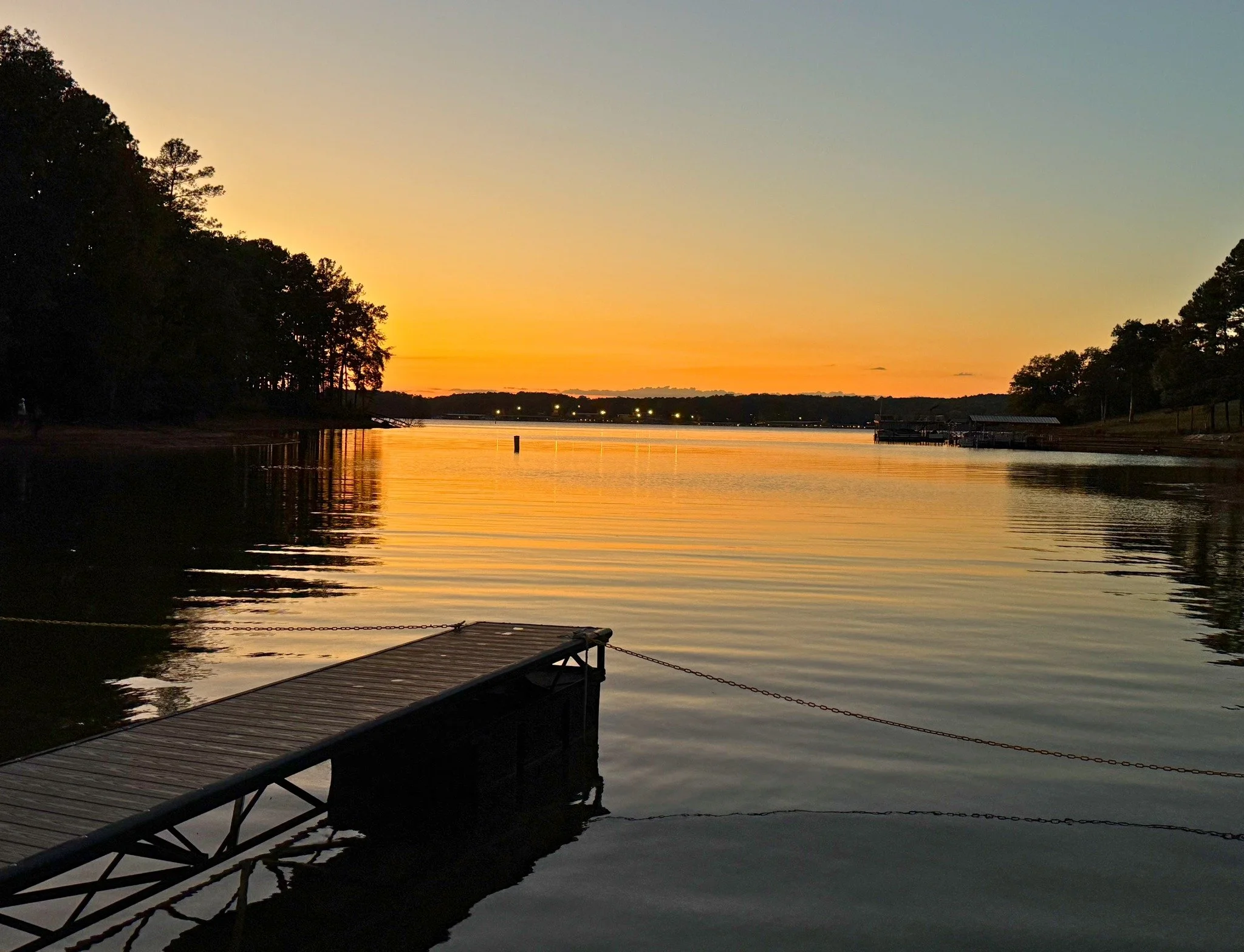 Join us on the dock with your favorite beverage, enjoy live music from the restaurant, and take in these stunning sunset views! 🌅

 #lakesunset #lakeviews #andersonsc #pullupachair
