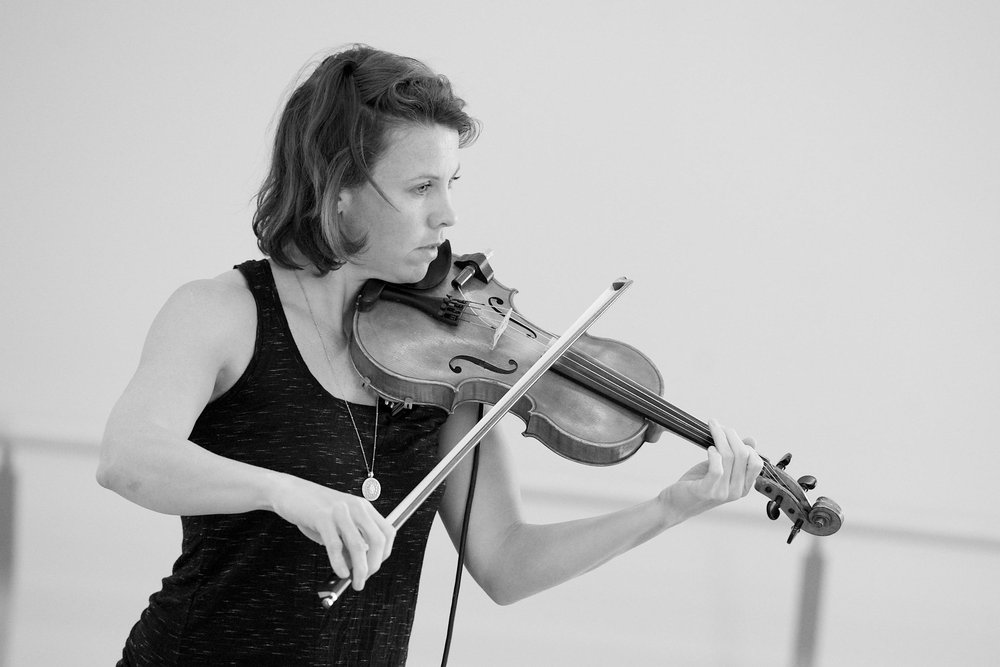  A closeup of Sarah Neufeld playing her violin.  