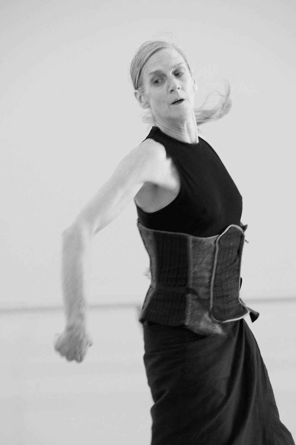  Peggy Baker, mid-movement, looking to her right as her right arm moves toward the front of her body.  