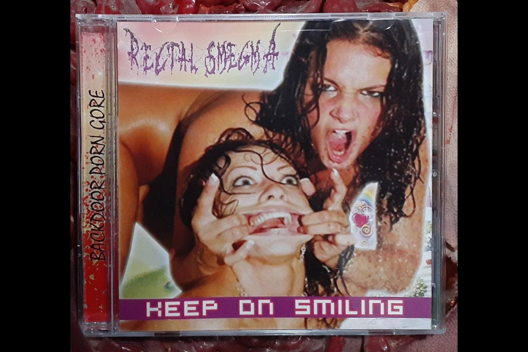 RECTAL SMEGMA - Keep On Smiling CD.jpg