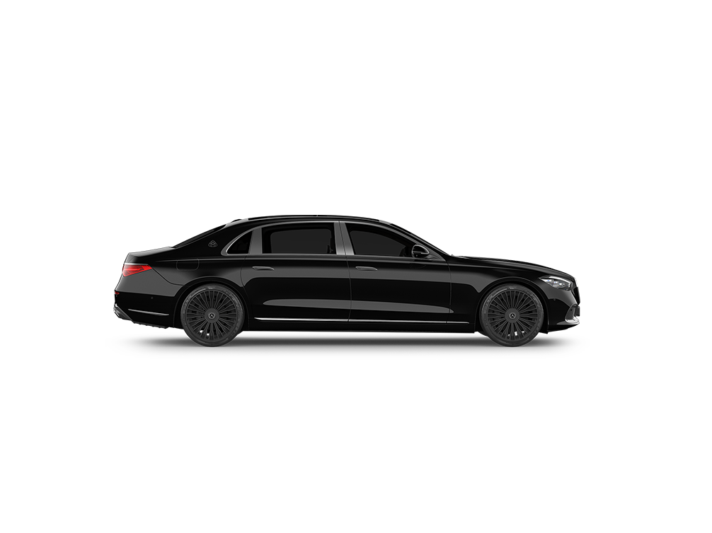 A sleek black luxury sedan driving on a flat, dark background.