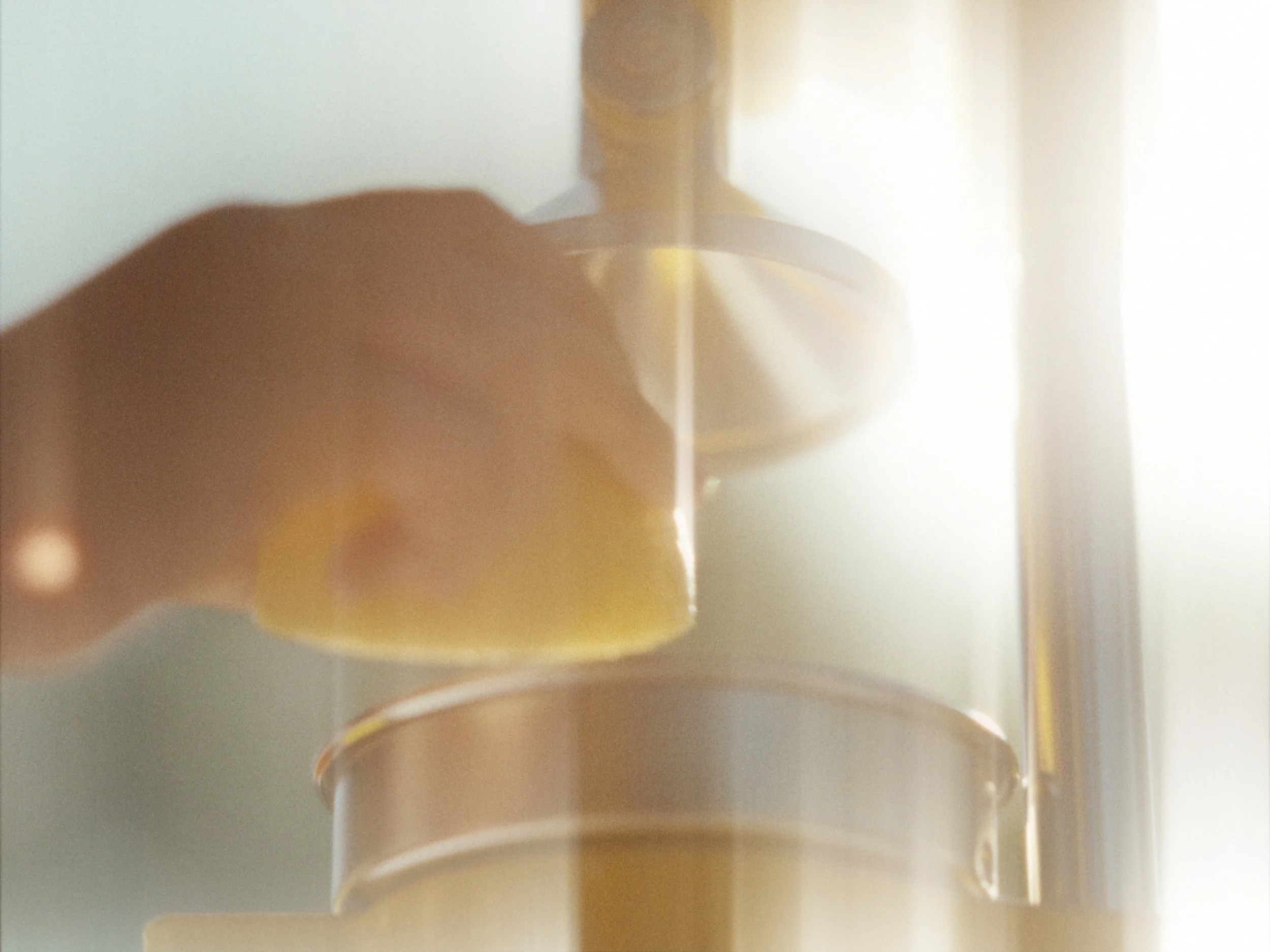 Close-up of a stack of beige coffee cups.