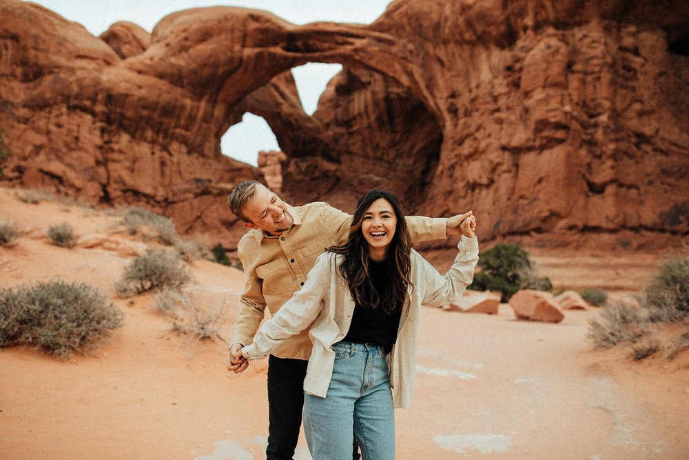 Madi_Tristan_Arches_National_Park_Sand_Dunes_Elopement_Engagement_Couples_Portraits_Utah_South_West_United_States_Roadtrip__moody_Photographer_Wedding_KMP_Photography-4021.jpeg