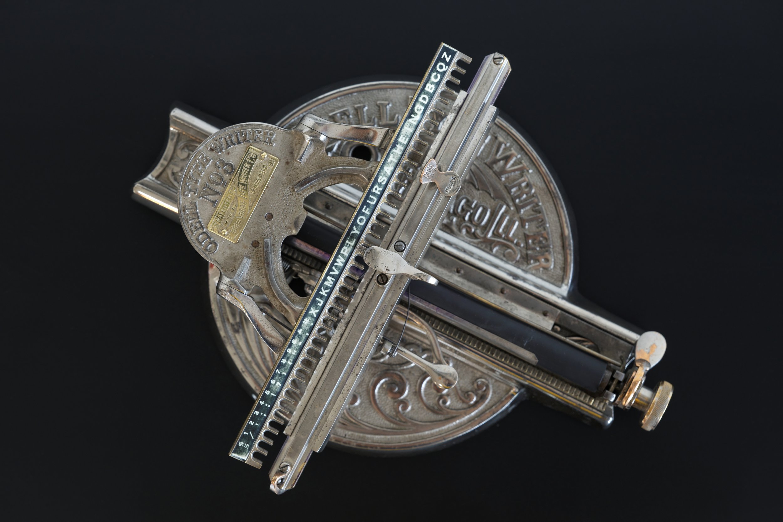 Top Down View of the 1890 Odell Typewriter manufactured in Chicago Illinois.  Shows the carriage, as well as the index selection rod for typing.