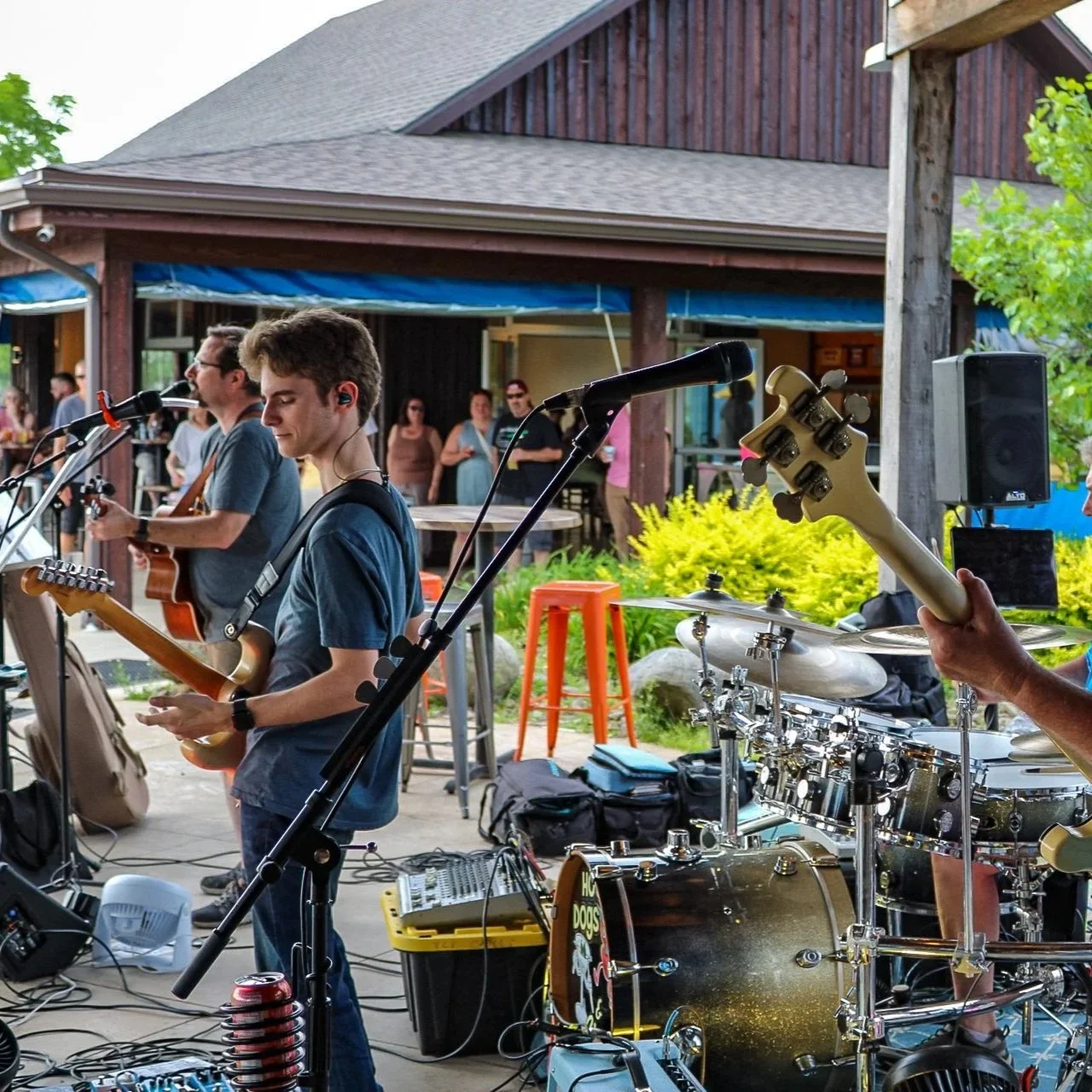 A band with guitar players at the front