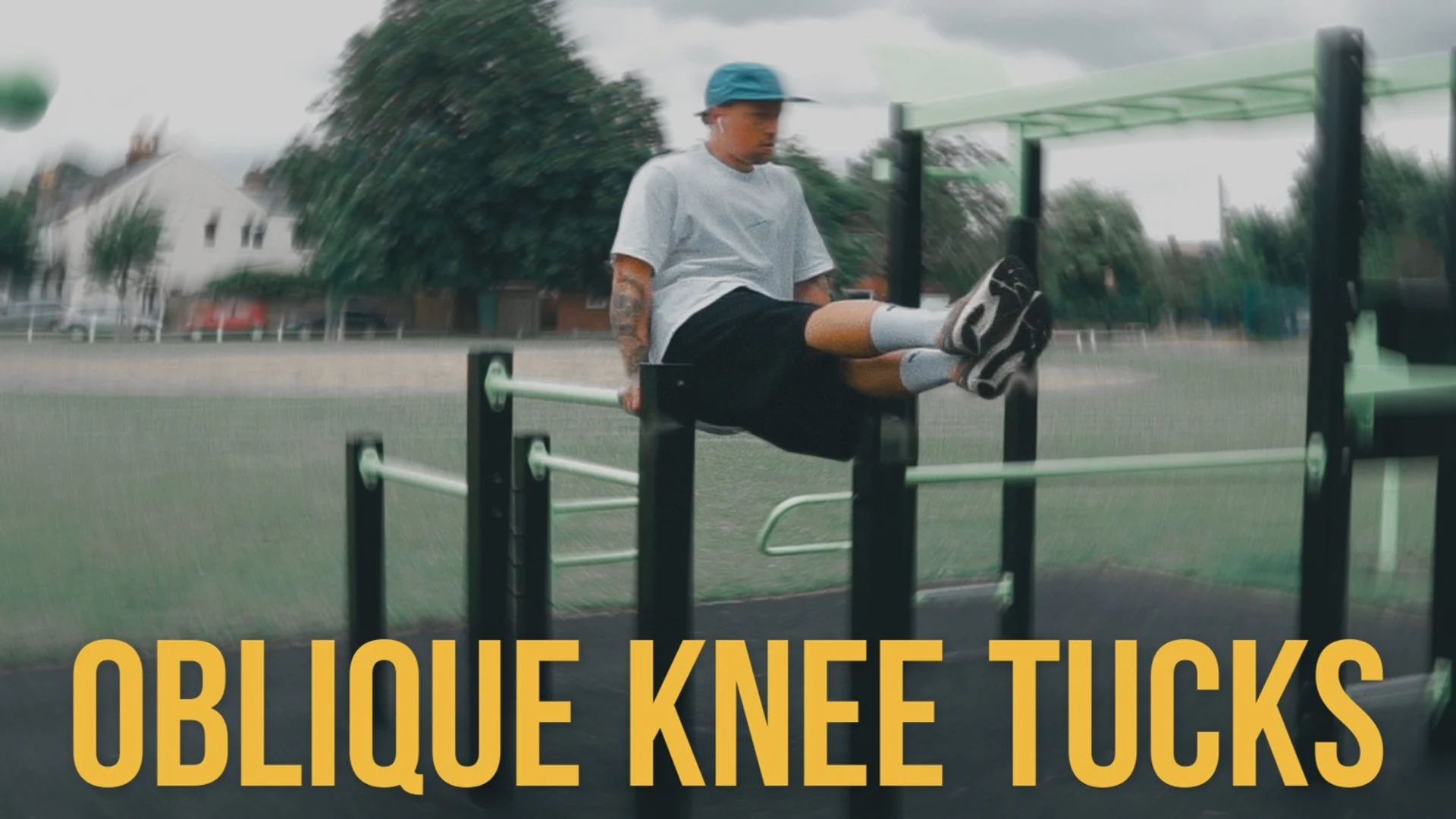 Dip bar abs - oblique knee tucks thumbnail.JPG