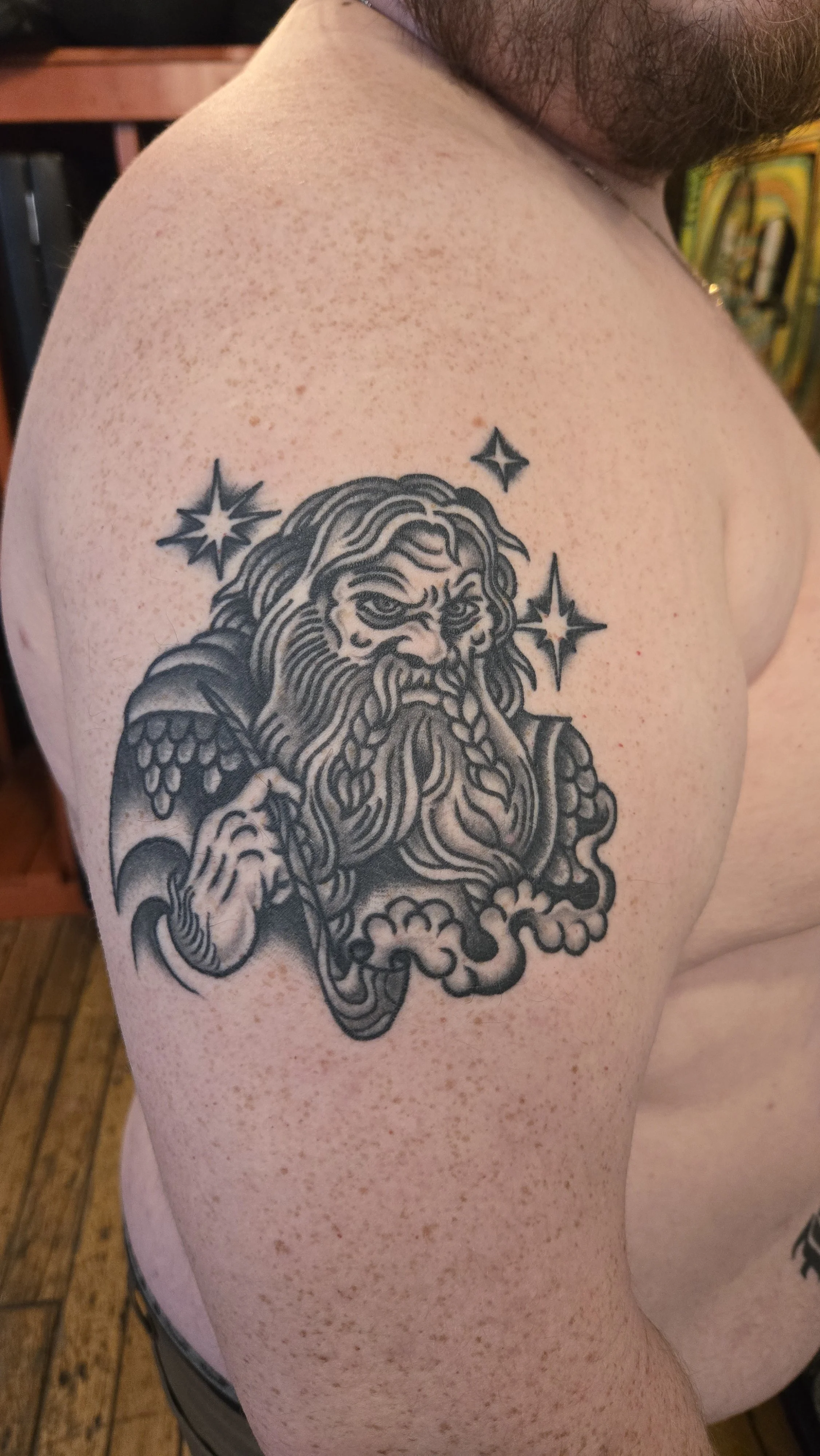 Gimli, son of Gloin in black and grey. He looks contemplative, holding his smoking pipe surrounded by glowing stars. 