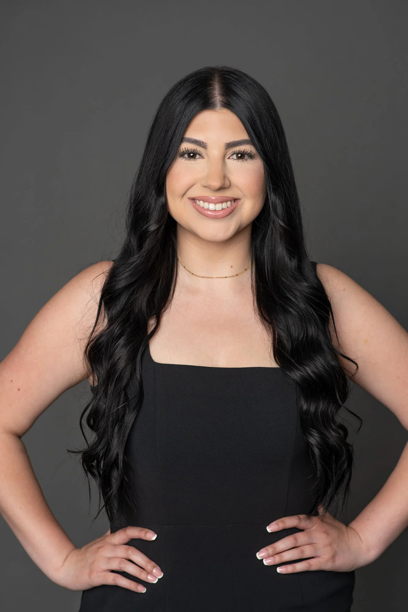 Women in black blouse with her hands on her hips
