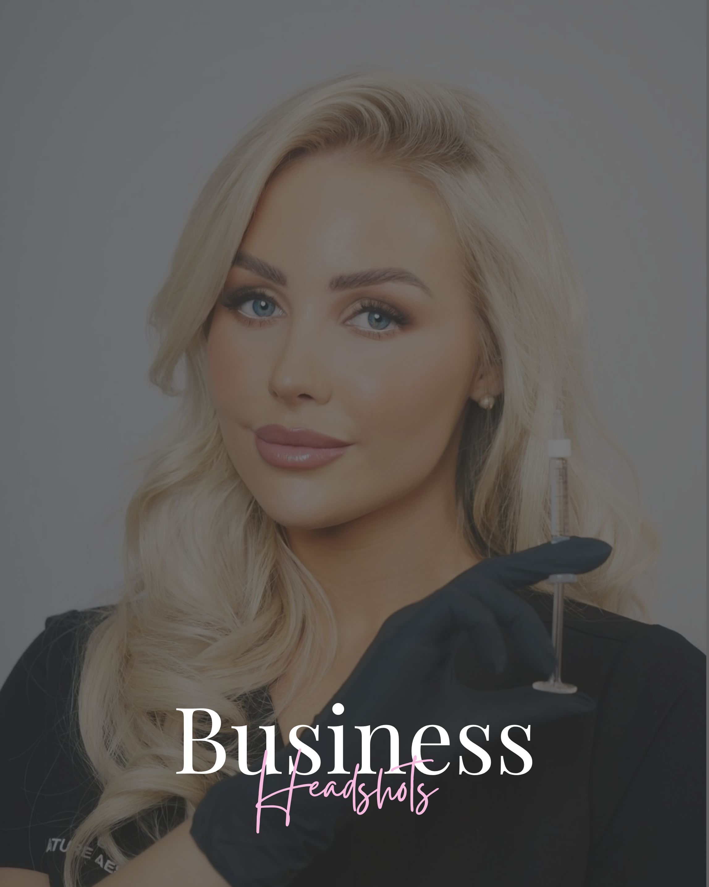 A woman with long blonde hair and blue eyes holding a syringe, wearing black gloves and a black shirt, with text 'Business Headshots' overlaid.