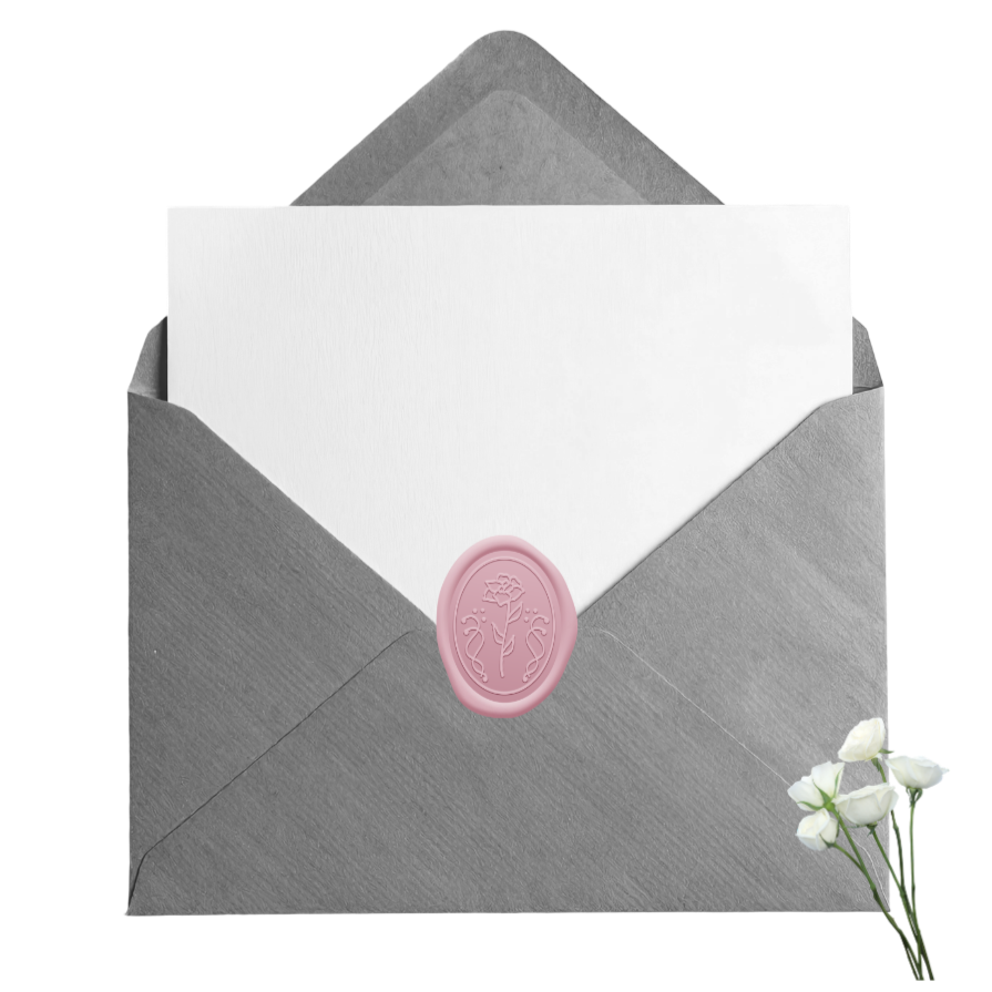 Gray envelope with a pink wax seal, white card partially pulled out, and white flowers beside it.