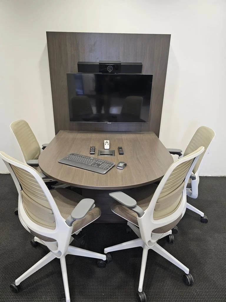 Table with screen and chairs.jpeg