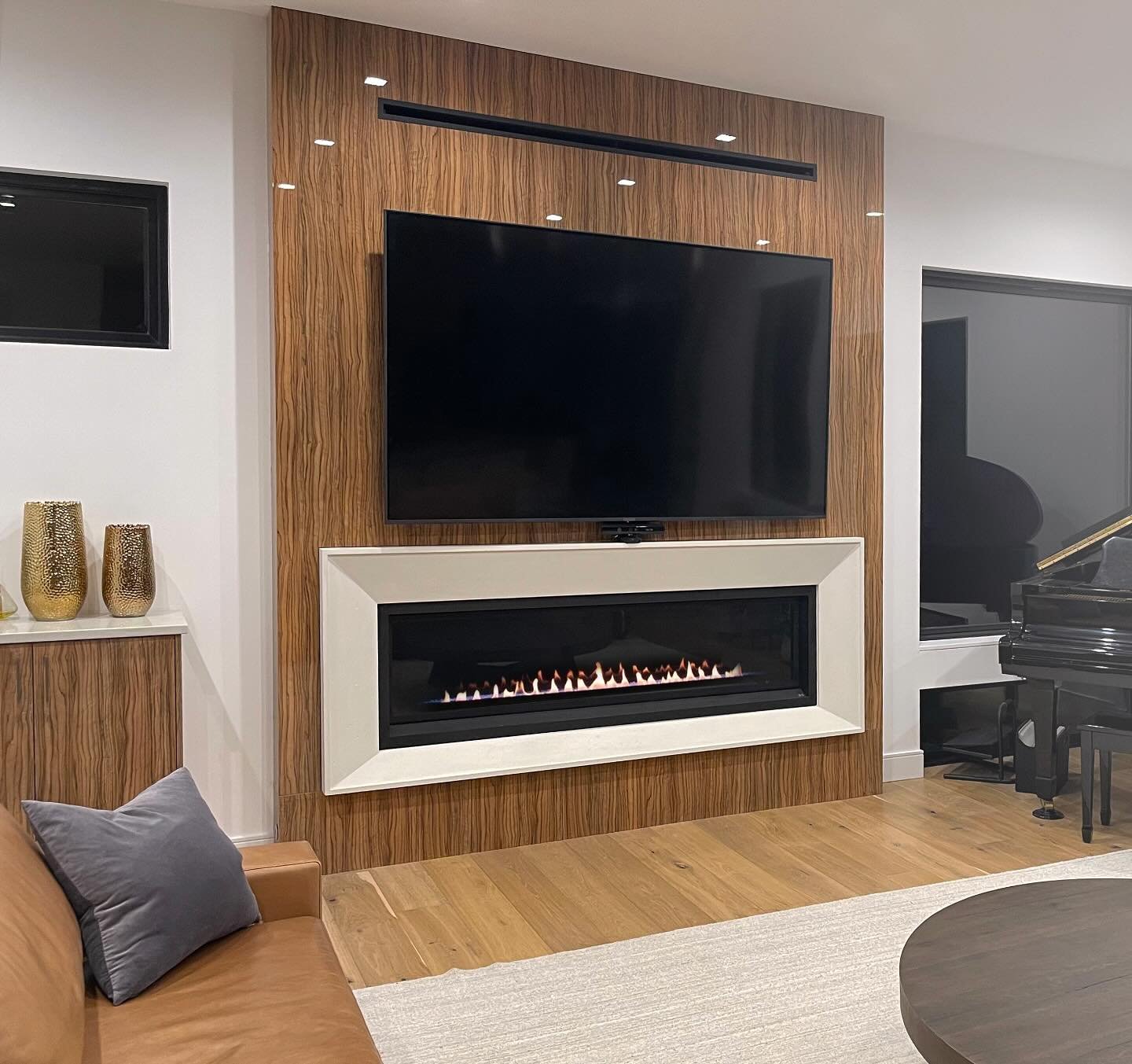 Clean, modern, and bold.
This custom 8&rdquo; modern precast fireplace surround is paired with rich wood paneling to create a warm yet contemporary focal point.

#ModernFireplace #PrecastSurround #FireplaceDesign #WoodPaneling #InteriorInspo #CustomF