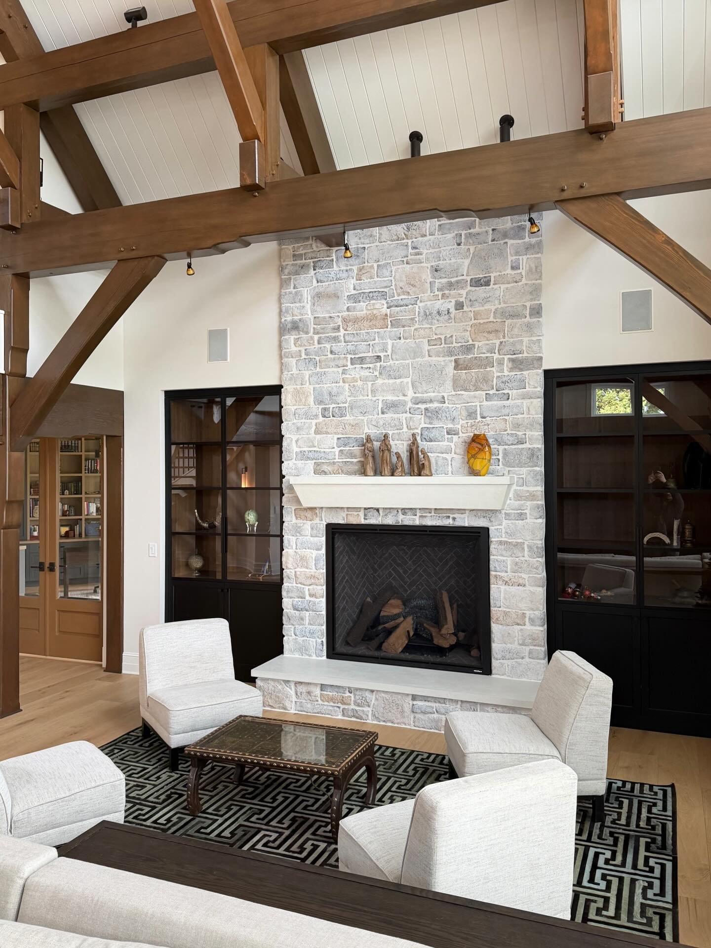 A Modern stone mantel with a matching stone hearth .
 .
.
. 
#stonemantel #fireplacedesign #customstone #moderninteriors # stonehearth