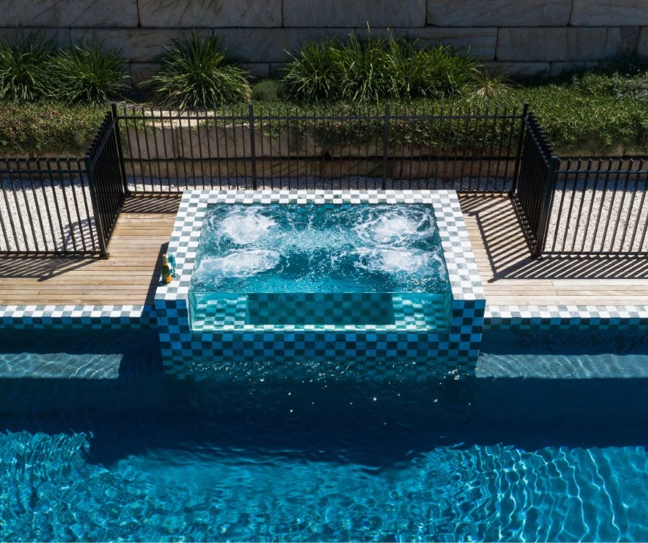 This spa in our Orangeville completed project is one of our favourite features of the build!⁠
⁠
With a glass retaining wall that bridges a connection to the pool, the spa area is made to feel intentionally inclusive. Why have a separate pool and spa 