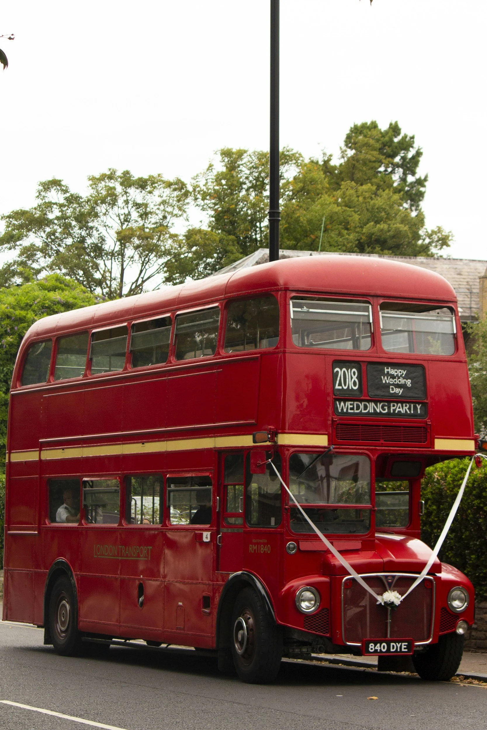 classic red double decker bus used for a wedding in England