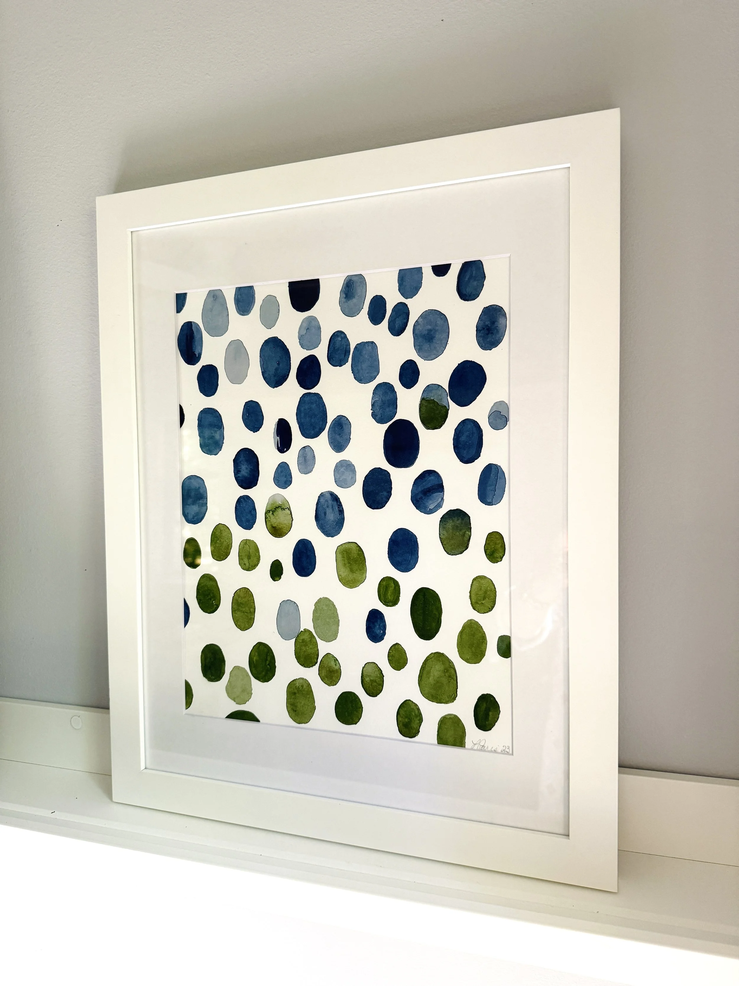 Northwest print framed on shelf.jpg