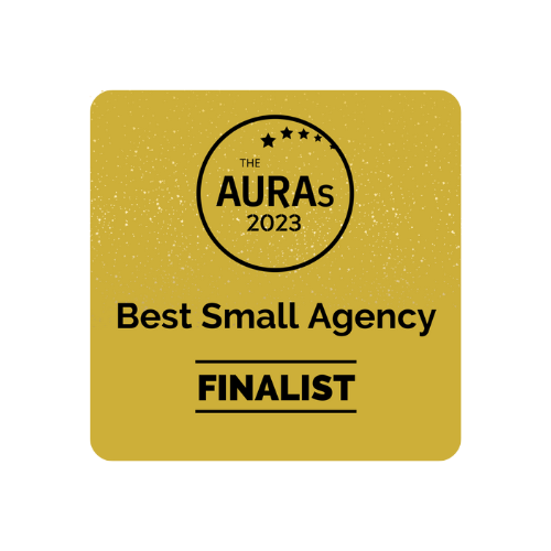 The AURAs 2023 Best Small Agency Finalist badge with stars on gold background.