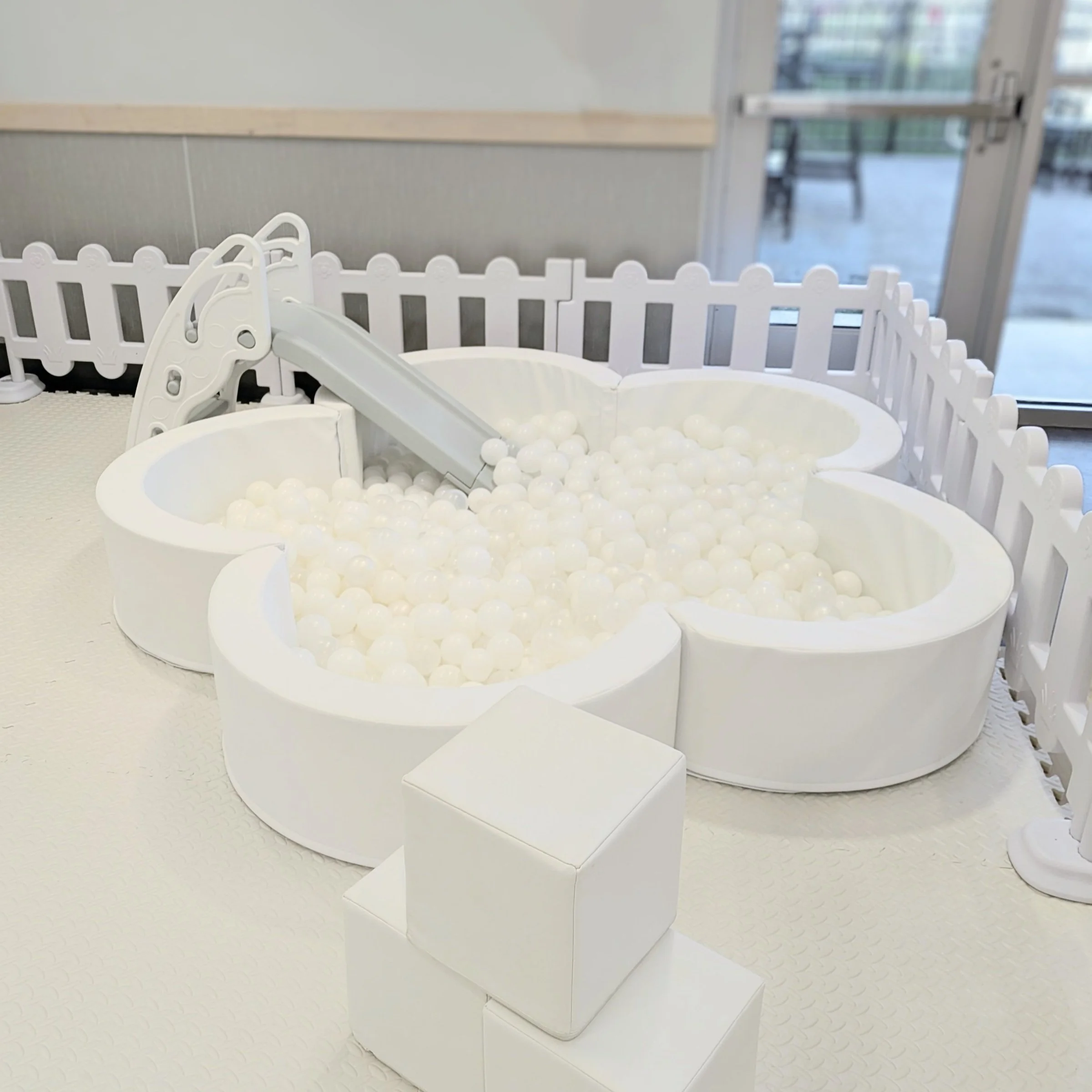 5ft flower ball pit $450. 10ftx10ft space needed for play area. Ball Pit, Slide, Jumbo Blocks, Animal Hopper, Flooring. ***Decals are an add on.***