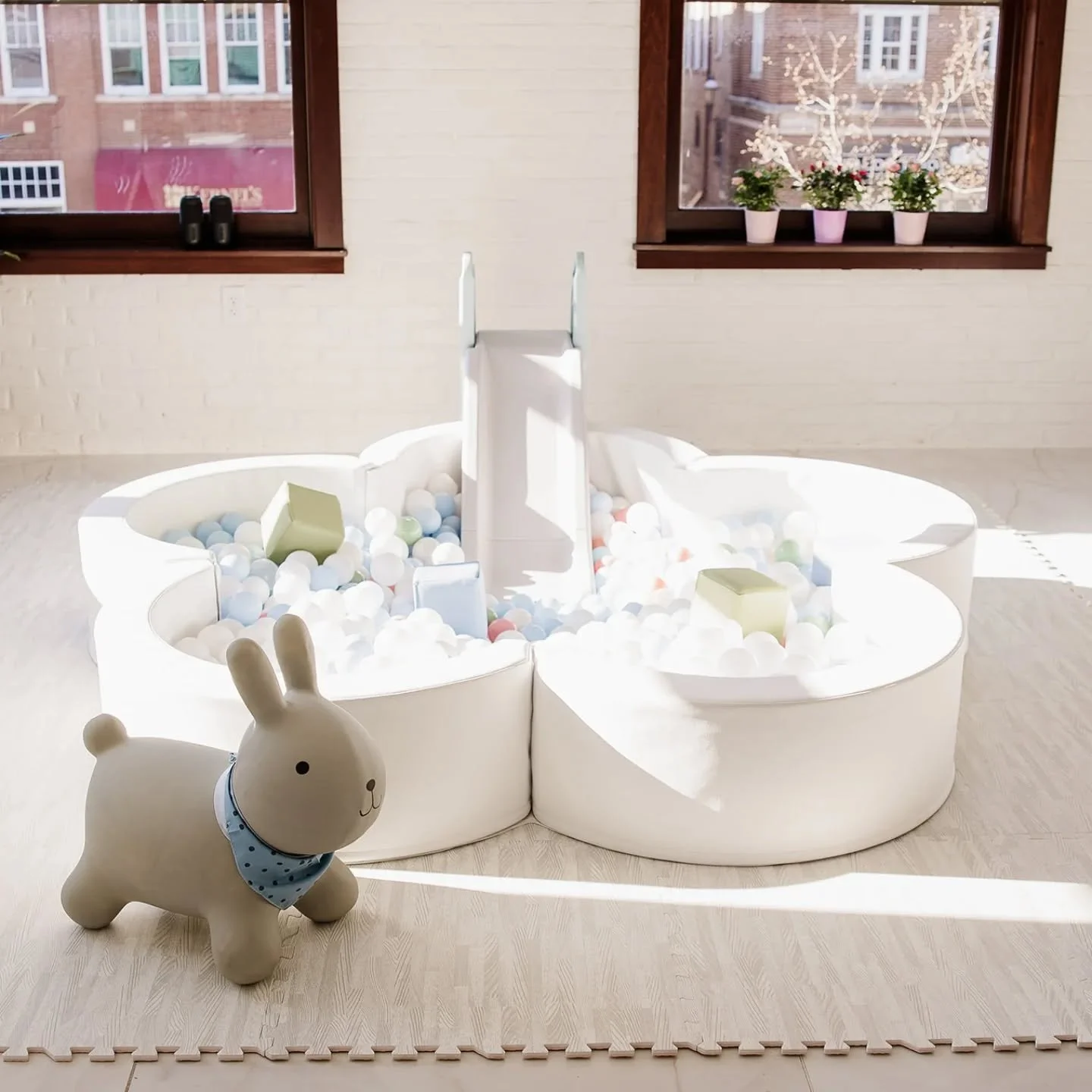 Everybody loves a bunny! Our soft play sets include an animal hopper, and this new bunny was a hit at @stateandsociety @graceful.joy.photography @looselydrapeddesigns 

#softplayrental #kidsparty #ballpitrental #genevail #geneva