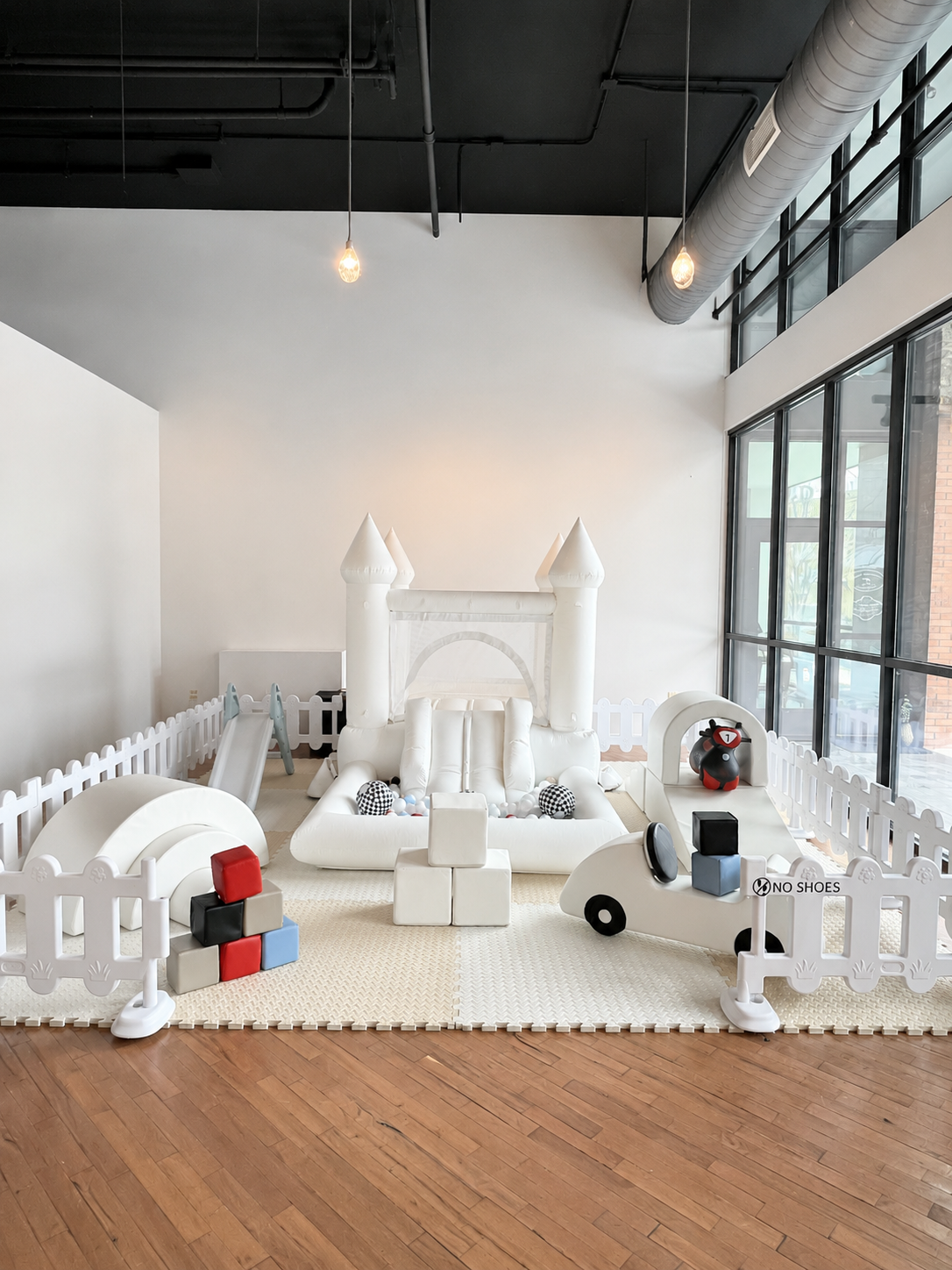 Indoor Midi Bounce House Set- 12'x12' Play Area (approx 4 additional feet needed to accommodate the bounce house blower tube behindd the play area), Midi Bounce House Set $525-- Ball Pit Bounce House, Slide, Rainbow, Arch Step and Slide, Jumbo Blocks