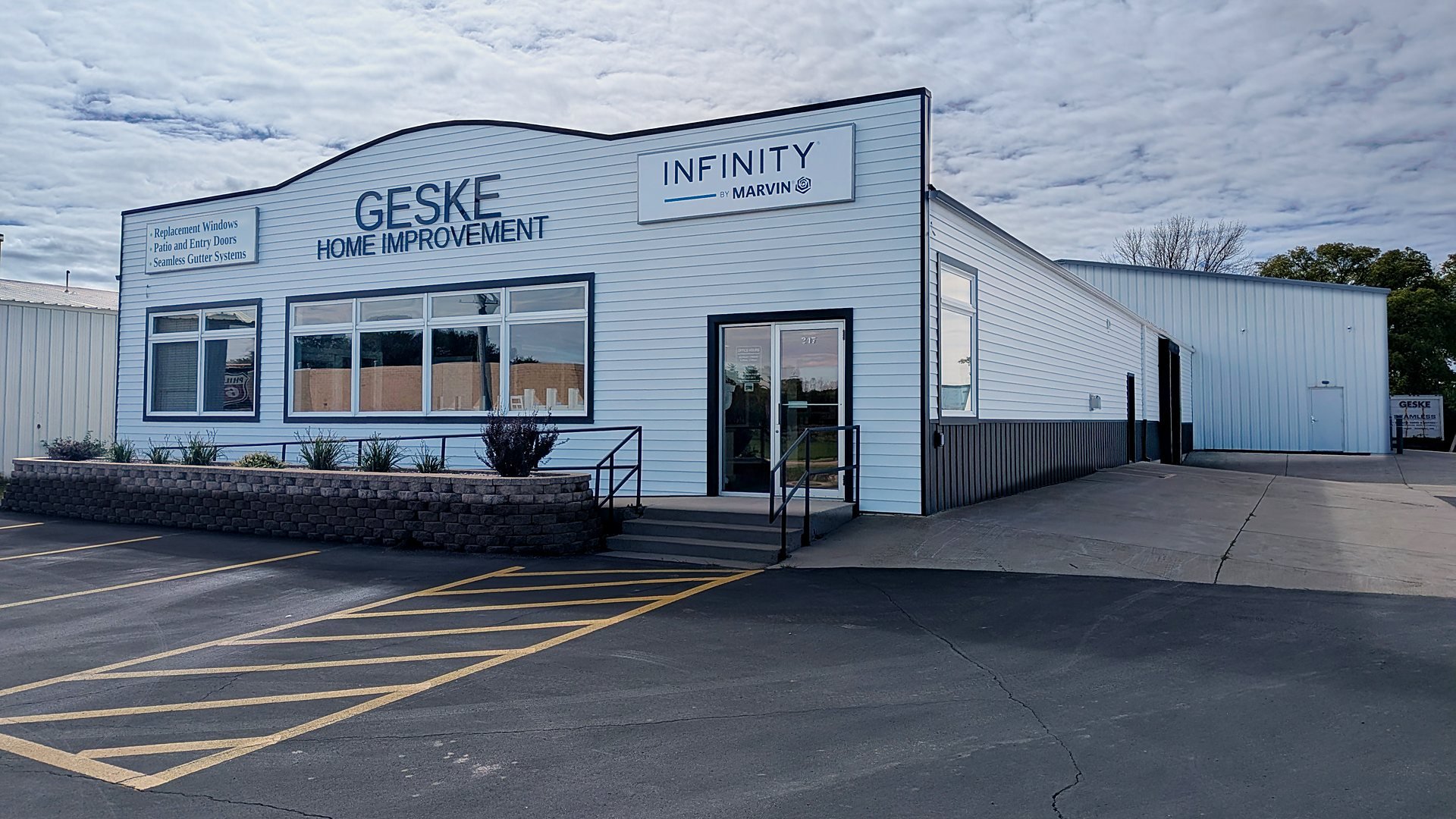 Geske Home Improvement building with Infinity by Marvin sign,