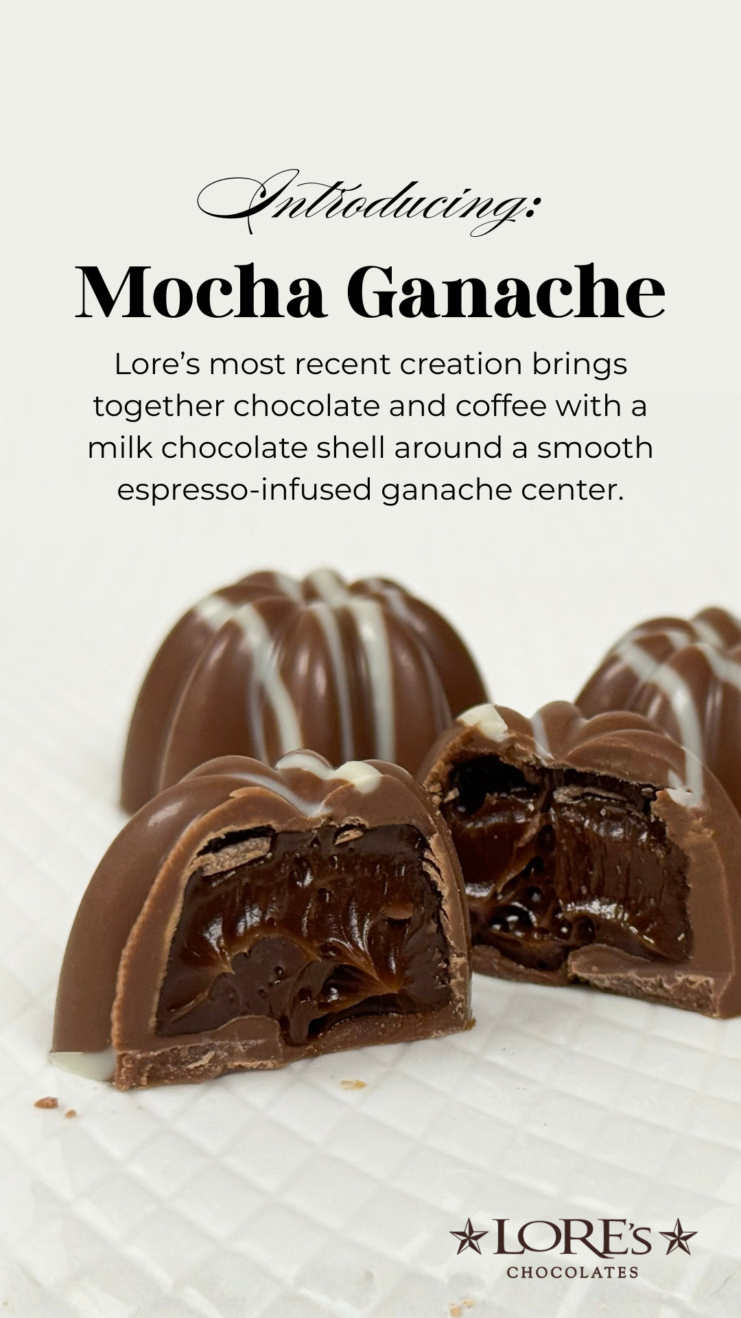 Image reads "Introducing: Mocha Ganache - Lore's most recent creation brings together chocolate and coffee with a milk chocolate shell around a smooth espresso-infused center" image shows a up close image of a milk chocolate truffle on white surface
