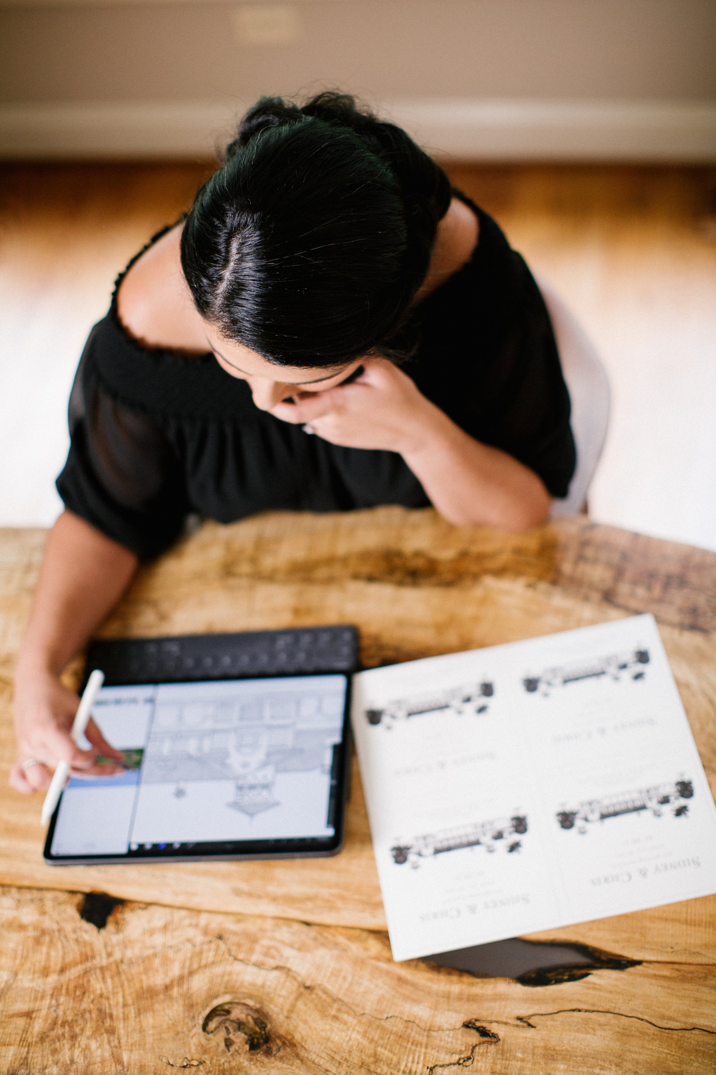 Loly while designing a custom wedding invitation suite