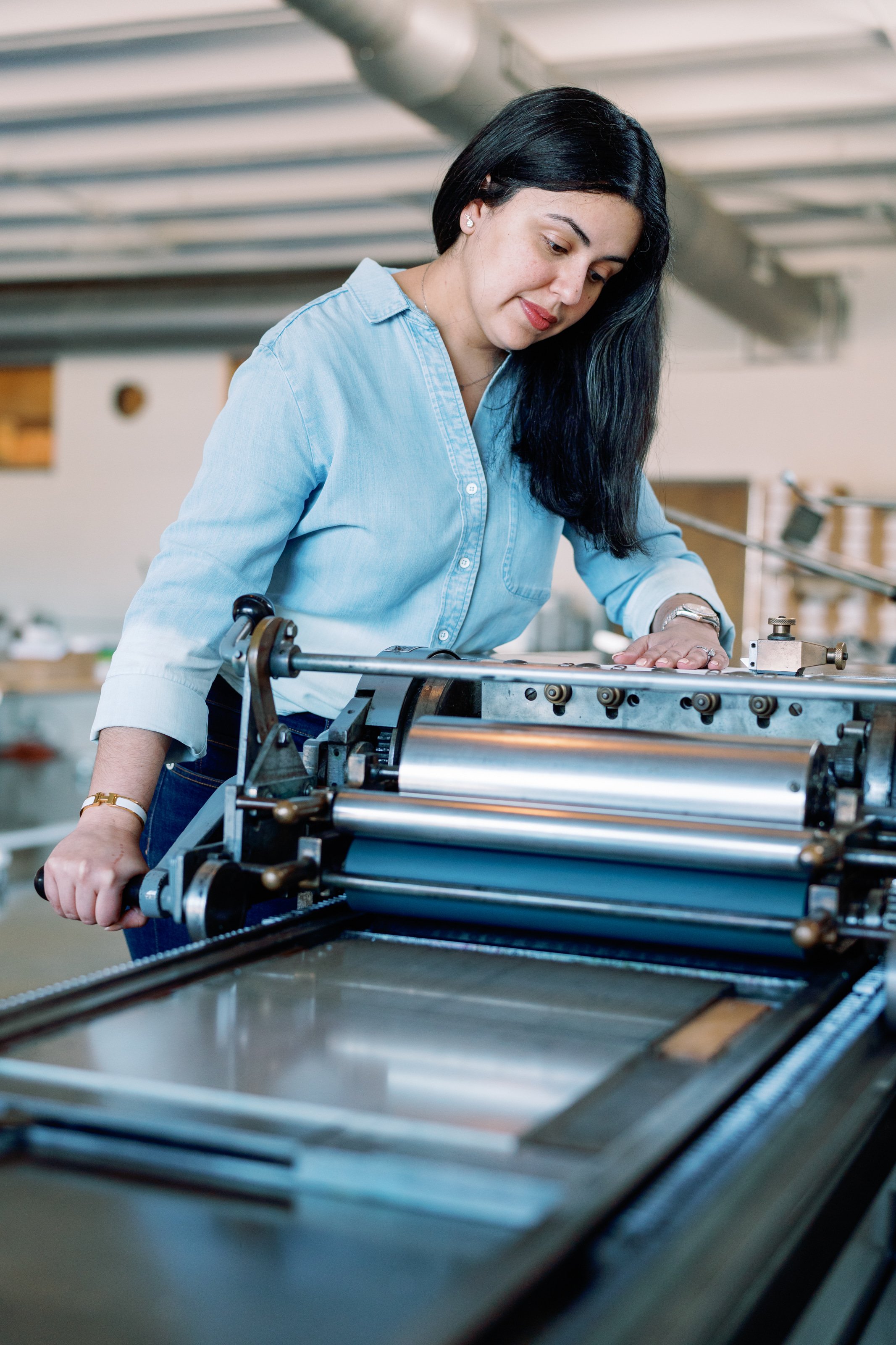 Loly using our vintage presses to make custom wedding invitations