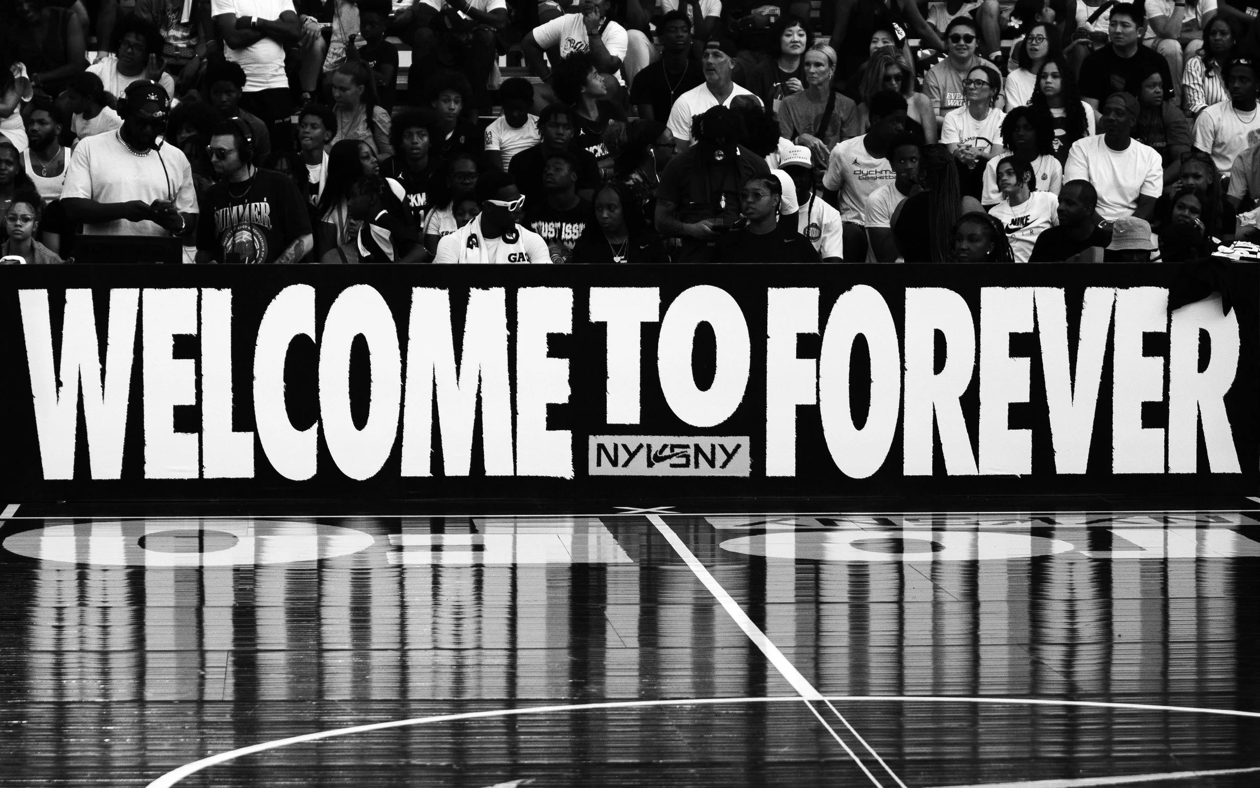 NIKE NEW YORK VS NEW YORK, NY VS, NY, NIKE NYC, YOUTH SPORTS, SPORTS PHOTOGRAPHY, 'WELCOME TO FOREVER' with the NYC logo, on a basketball court.