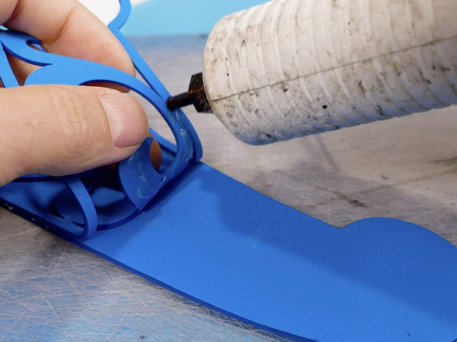 gluing the swirl piece down to the visor