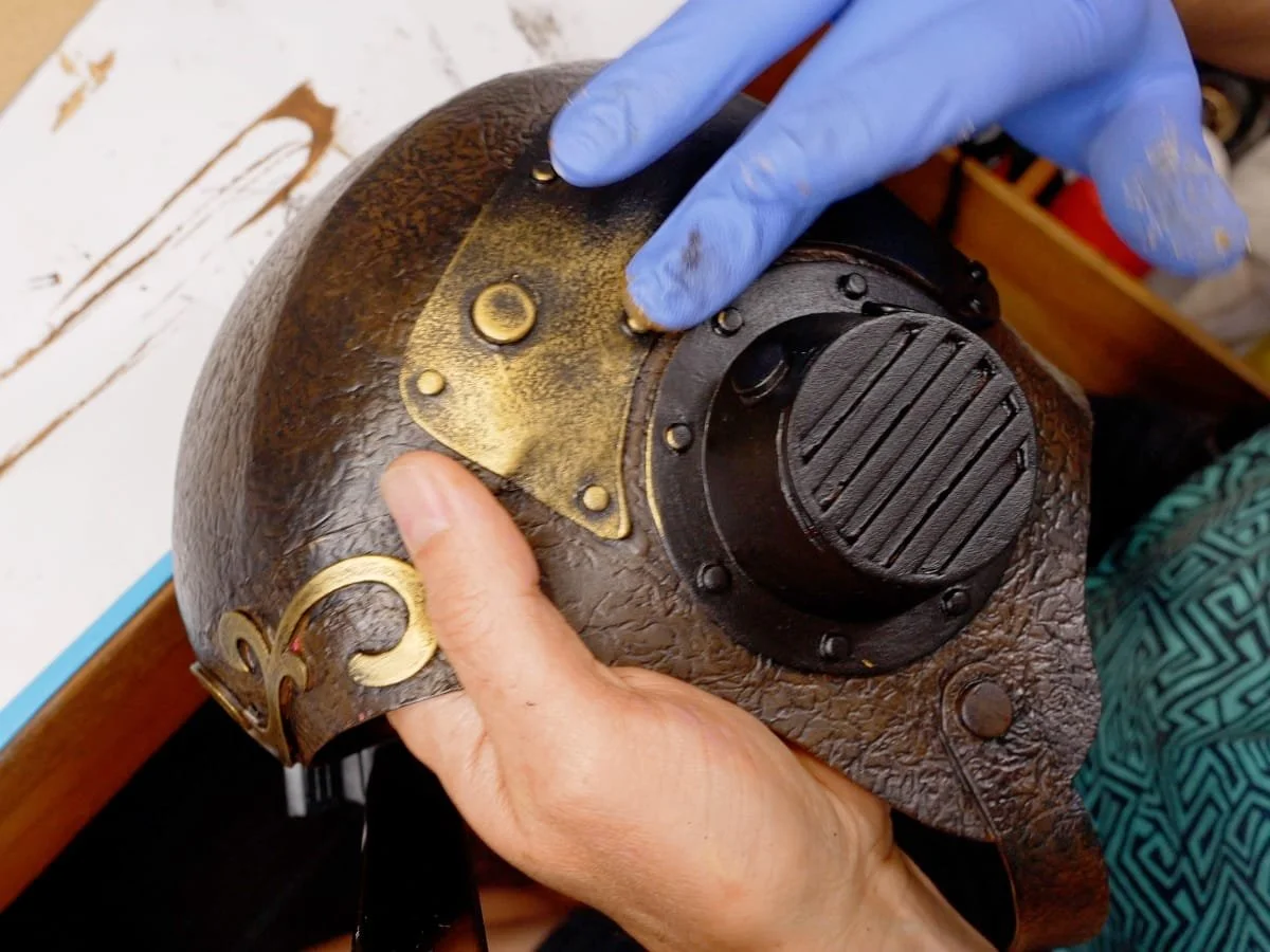 rubbing on the metallic brass paint