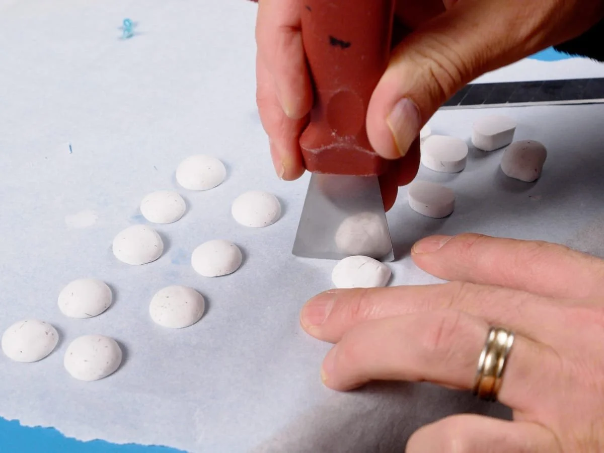 forming the polymer clay into a dome shape