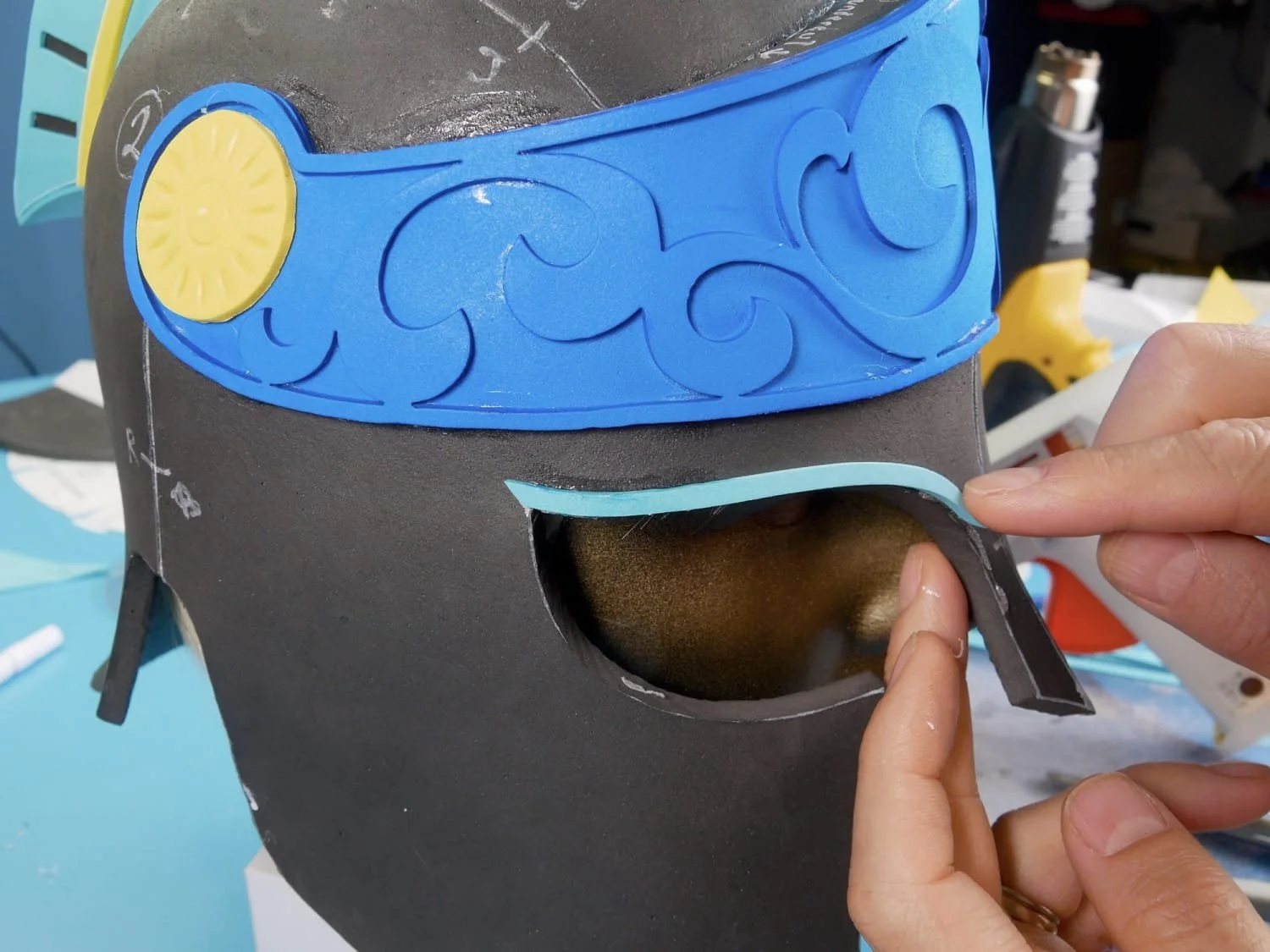 gluing strips around the edges the helmet