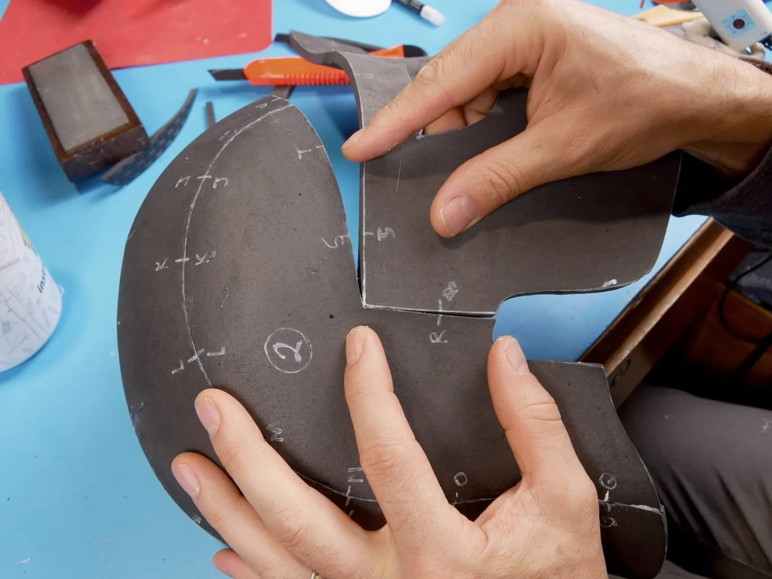 gluing the side of the mask piece on to the main helmet