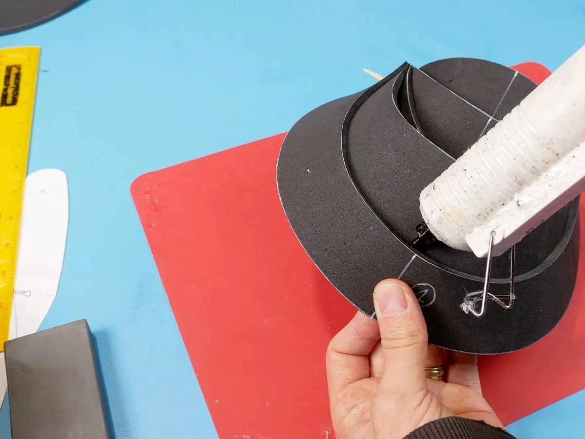 squirting hot glue between each band